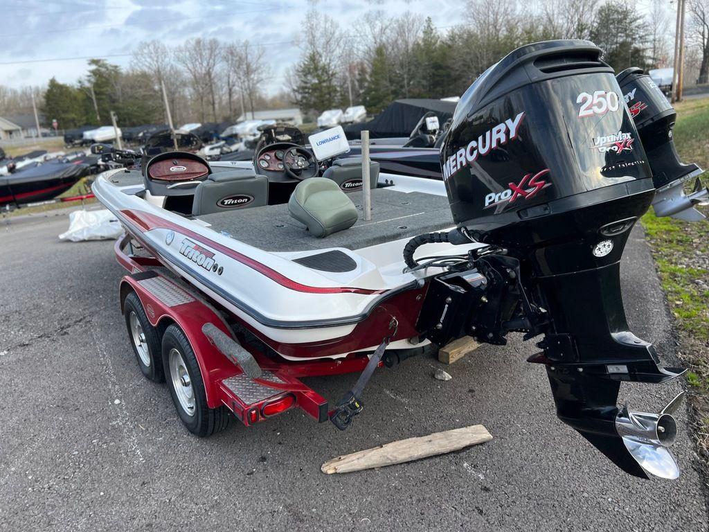 1999 Triton TR20 boat with Mercury 250 Pro XS engine on trailer.