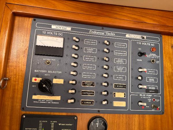 Electrical control panel of a 1984 Endeavour 38 yacht, featuring 12V DC and 116V AC systems.
