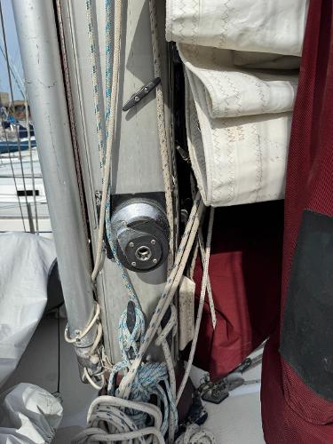 Close-up of 1984 Endeavour 38 sailboat mast with rigging and sails.