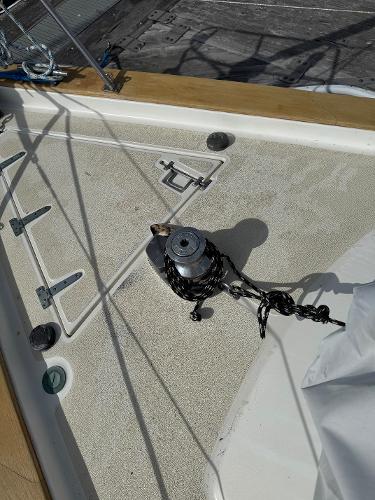 Deck of 1984 Endeavour 38 sailboat with winch and ropes.