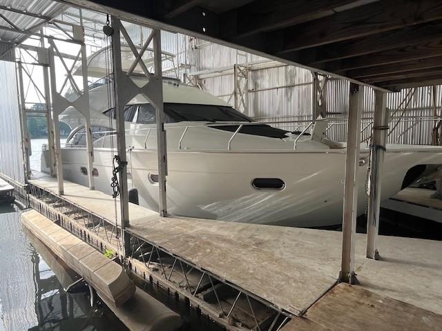 Marquis-59 2004 -IL-US-2004 Marquis 59 yacht docked in a covered marina.-9798156