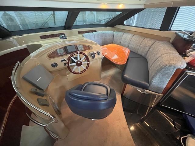 Marquis-59 2004 -IL-US-Luxurious 2004 Marquis 59 yacht interior with helm, plush seating, and modern controls.-9798156 | Thumbnail