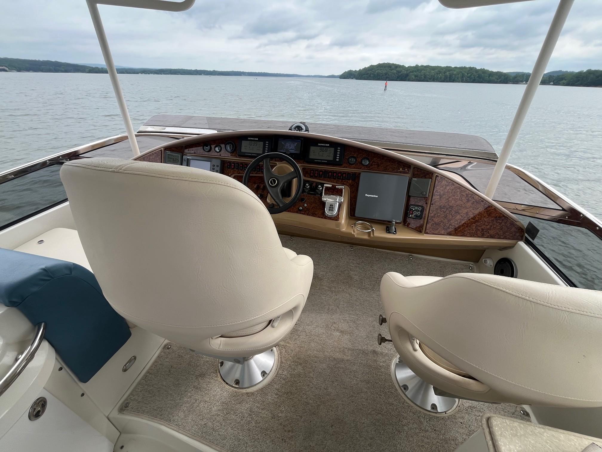 Marquis-59 2004 -IL-US-Helm of 2004 Marquis 59 yacht with dual seats, overlooking calm waters.-9798156 | Thumbnail