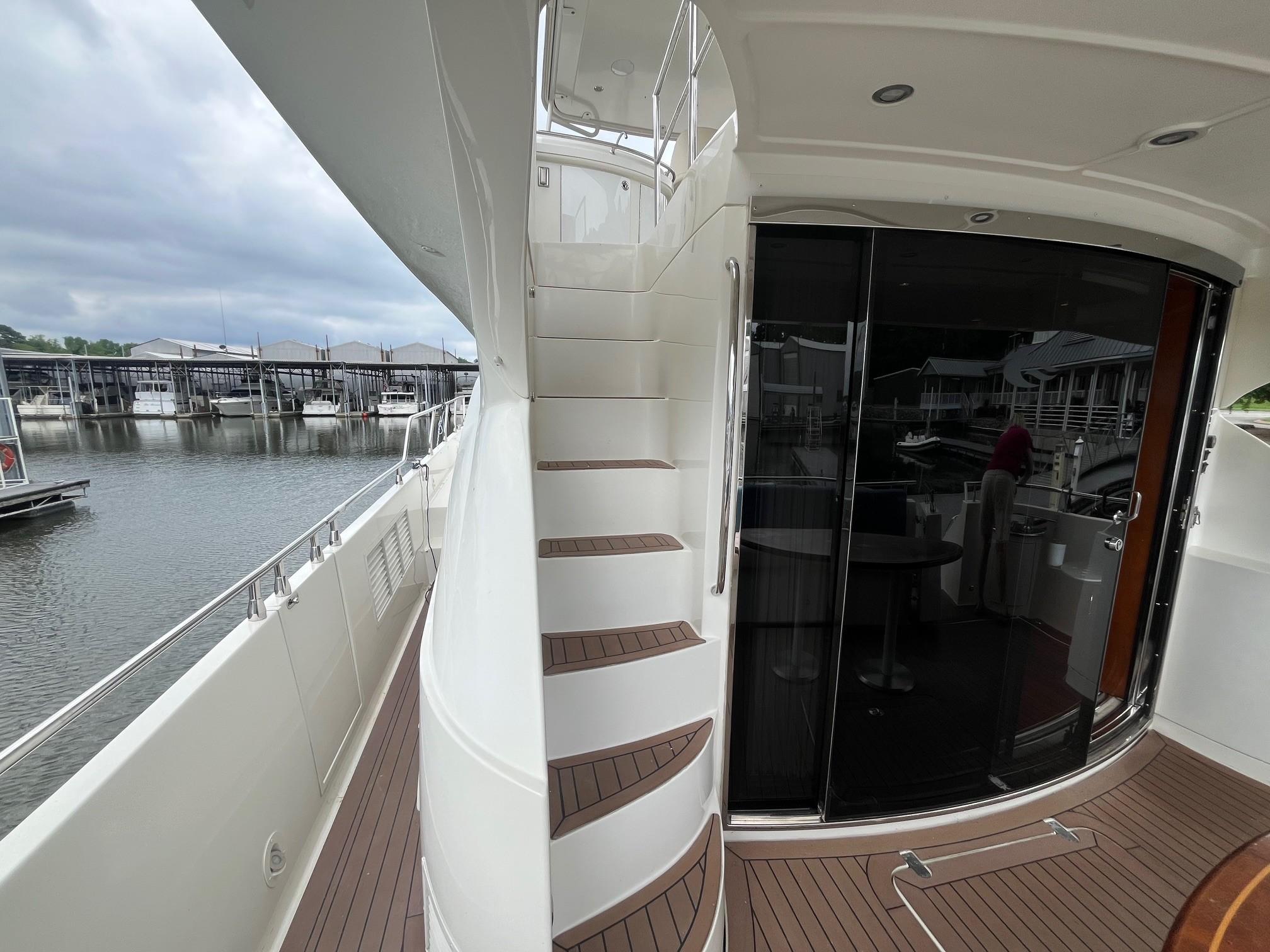 Marquis-59 2004 -IL-US-2004 Marquis 59 yacht with sleek exterior, docked at marina, featuring elegant staircase and glass doors.-9798156 | Thumbnail