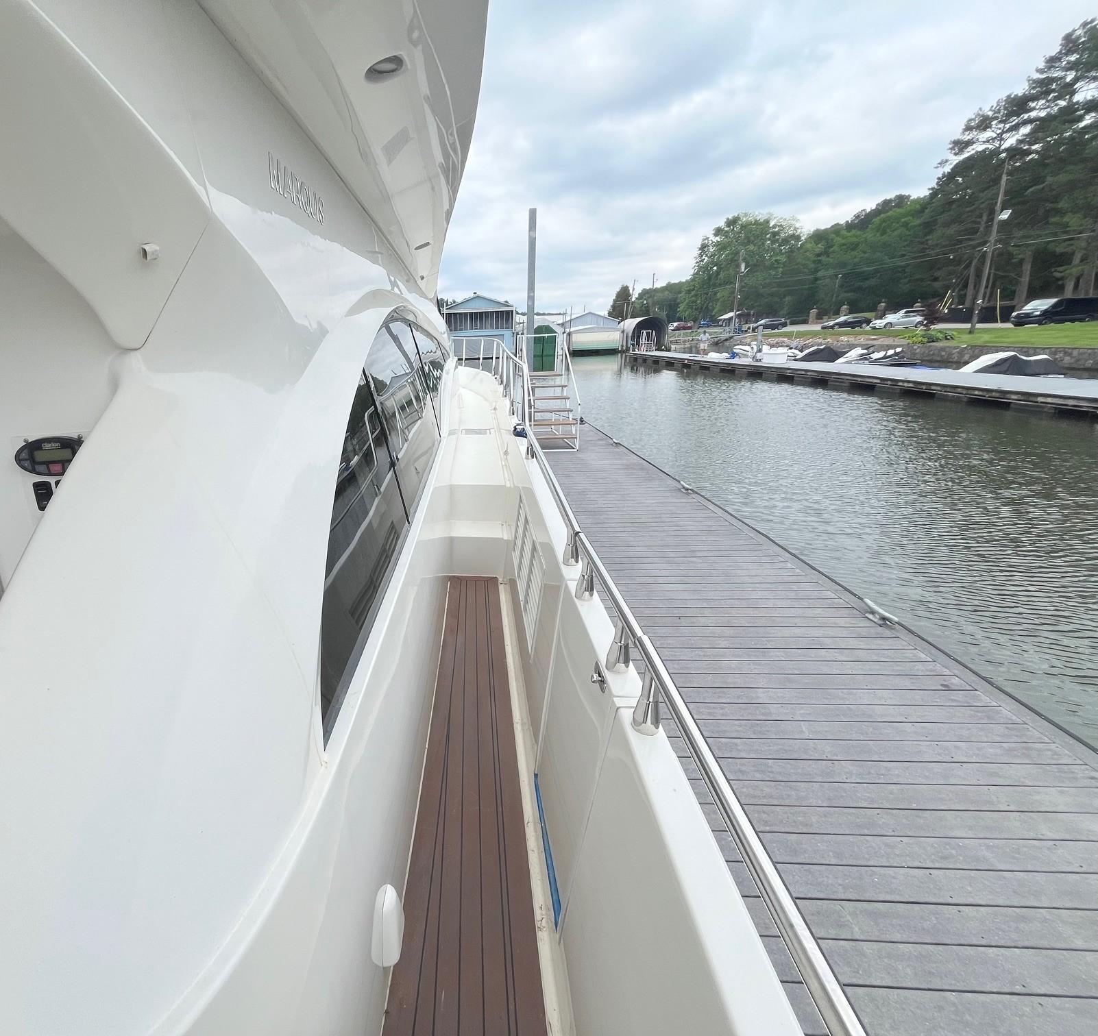 Marquis-59 2004 -IL-US-Side view of a 2004 Marquis 59 yacht docked at a marina.-9798156 | Thumbnail