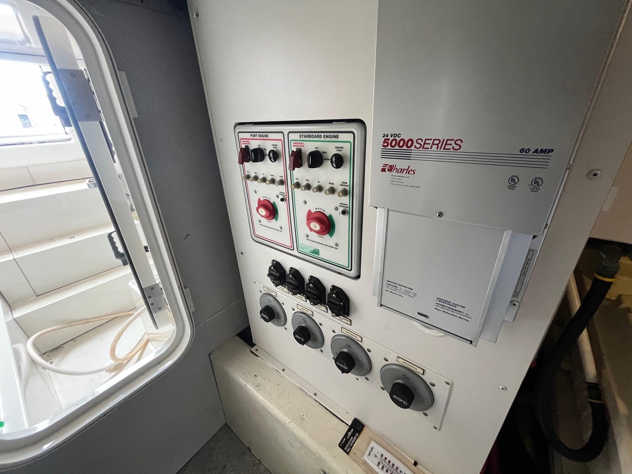 Marquis-59 2004 -IL-US-Electrical control panel inside a 2004 Marquis 59 yacht, featuring various switches and dials.-9798156 | Thumbnail