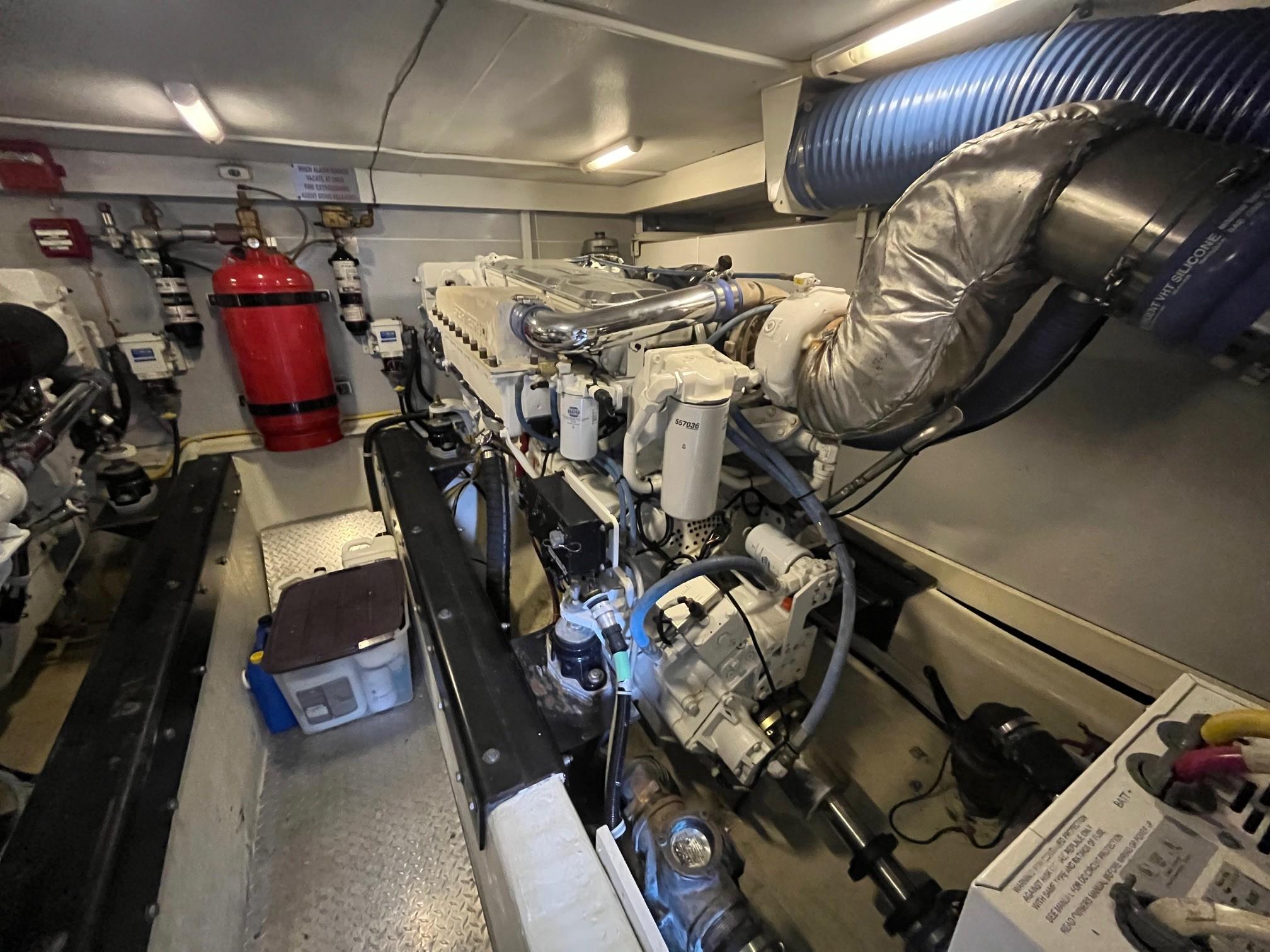 Marquis-59 2004 -IL-US-Engine room of a 2004 Marquis 59 yacht, featuring mechanical components and fire safety equipment.-9798156 | Thumbnail