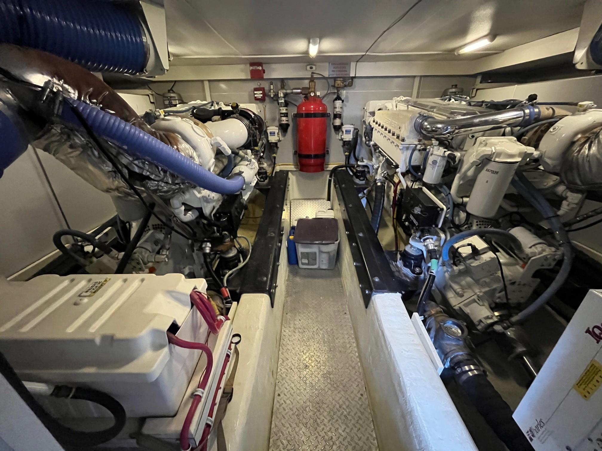Marquis-59 2004 -IL-US-Engine room of a 2004 Marquis 59 yacht, featuring dual engines and a fire extinguisher.-9798156 | Thumbnail