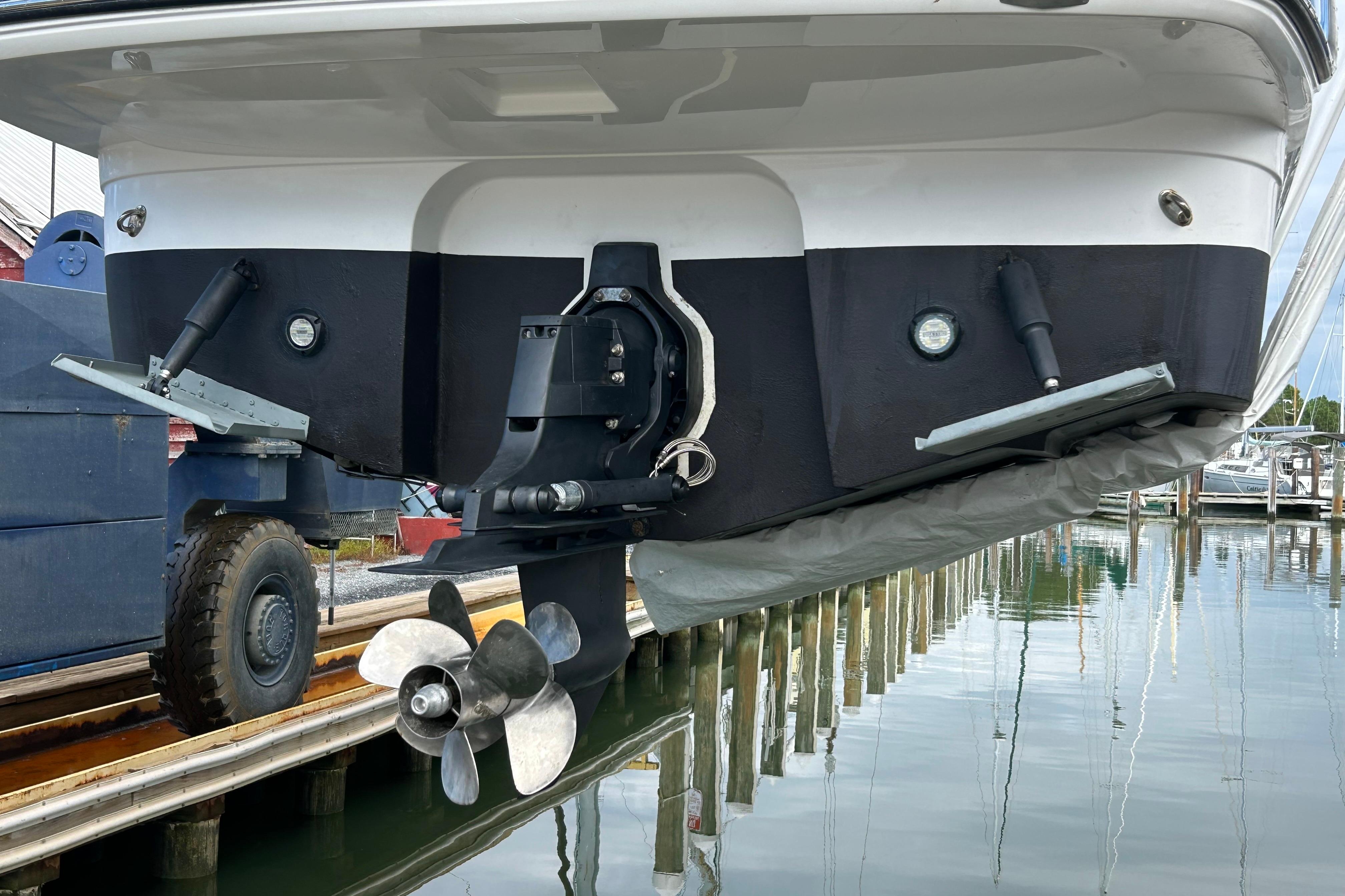 2019 Monterey 295 Sport Yacht stern view with propeller and trim tabs.