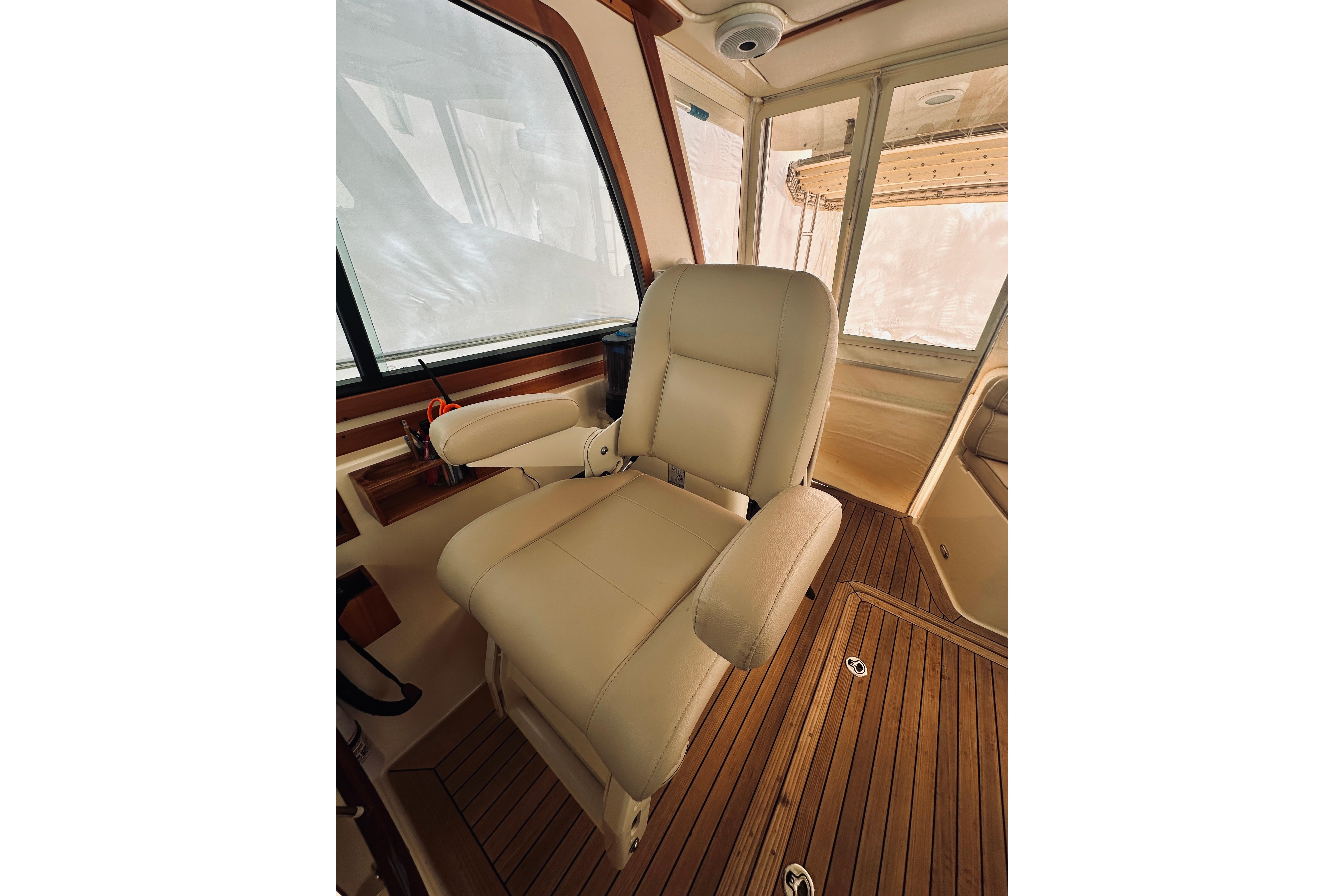 Luxurious helm seat in 2008 Sabre 38 Hard Top Express yacht interior.