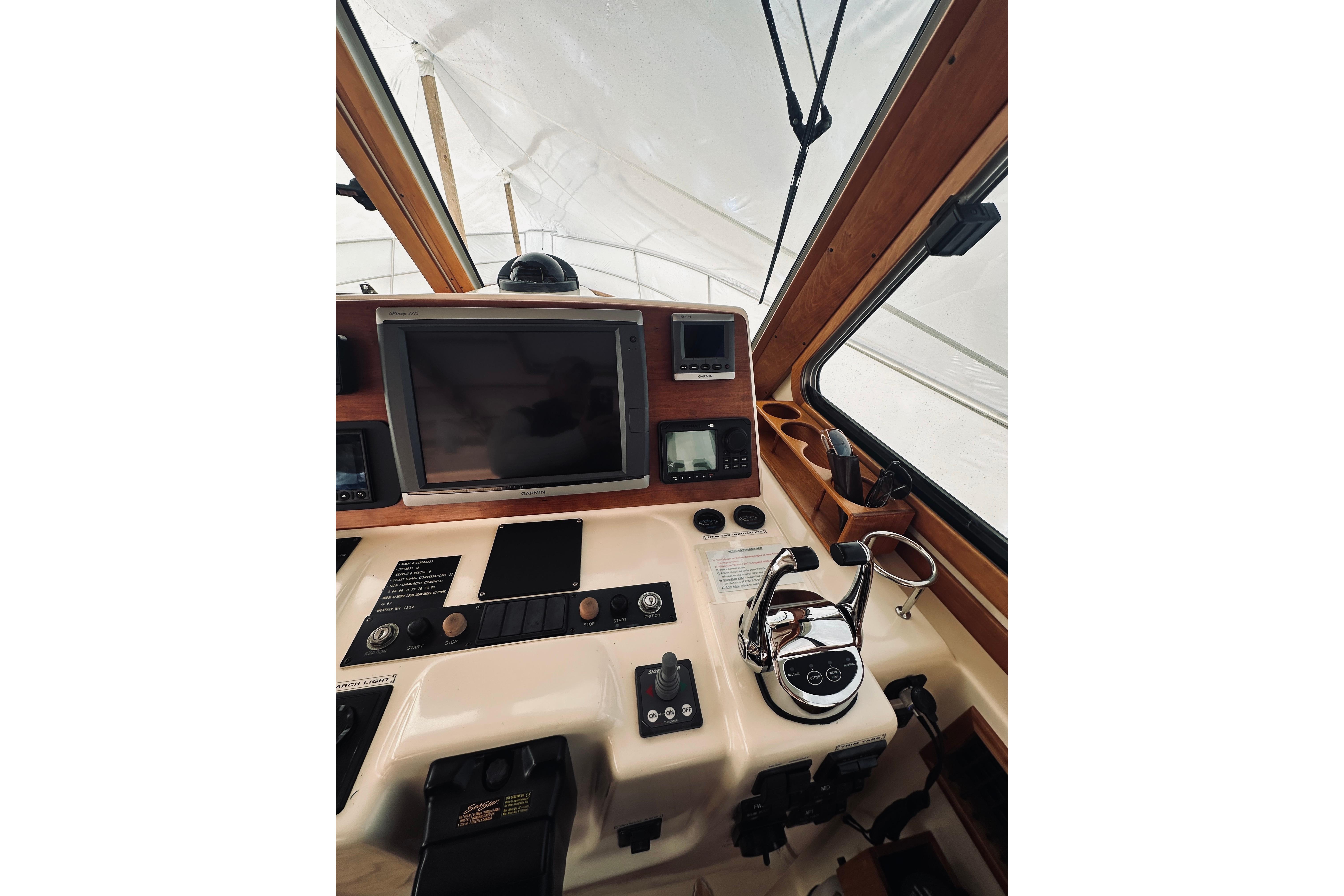 2008 Sabre 38 Hard Top Express helm with navigation equipment and controls.
