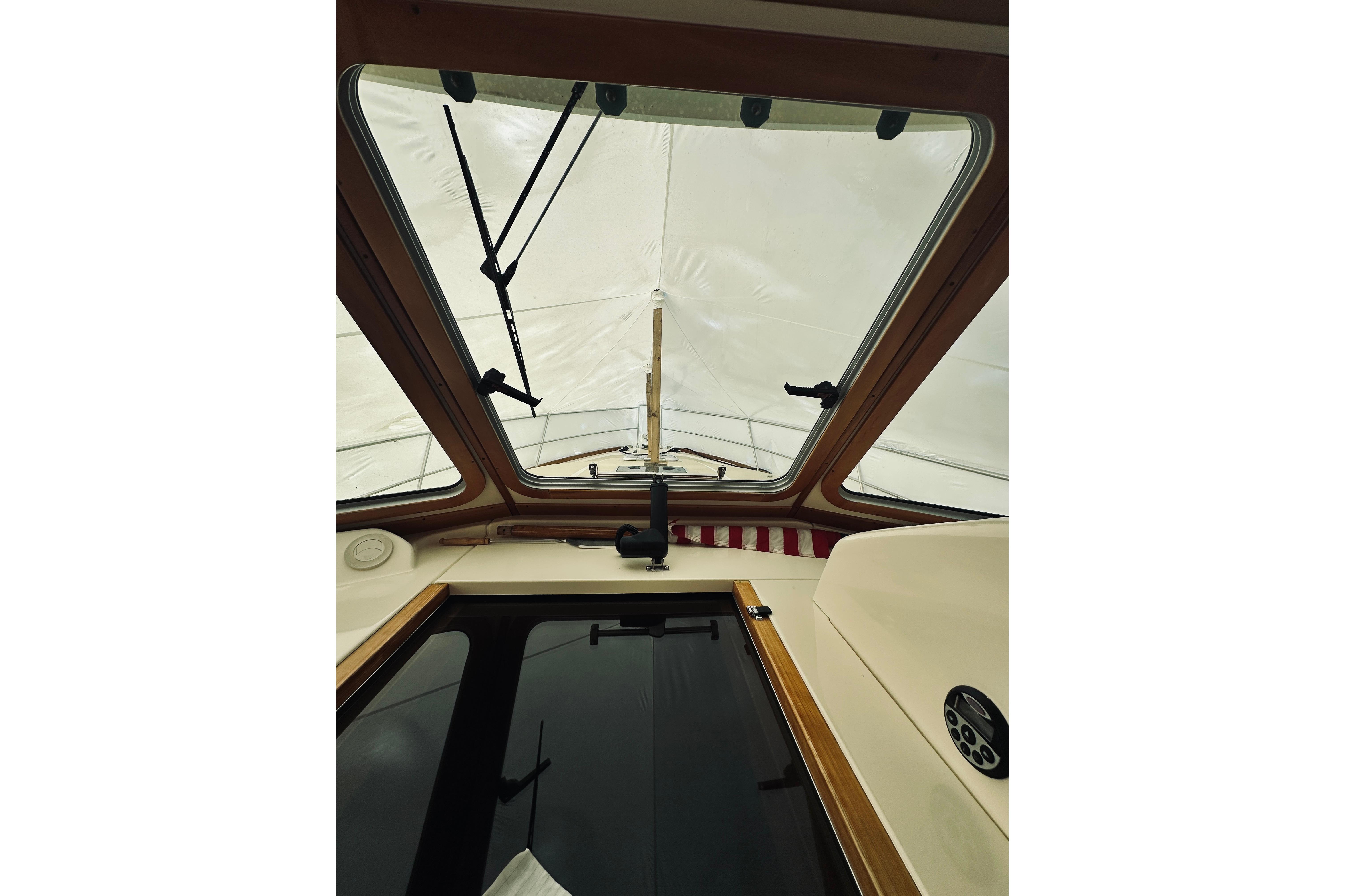 Interior view of 2008 Sabre 38 Hard Top Express boat with skylight and controls.