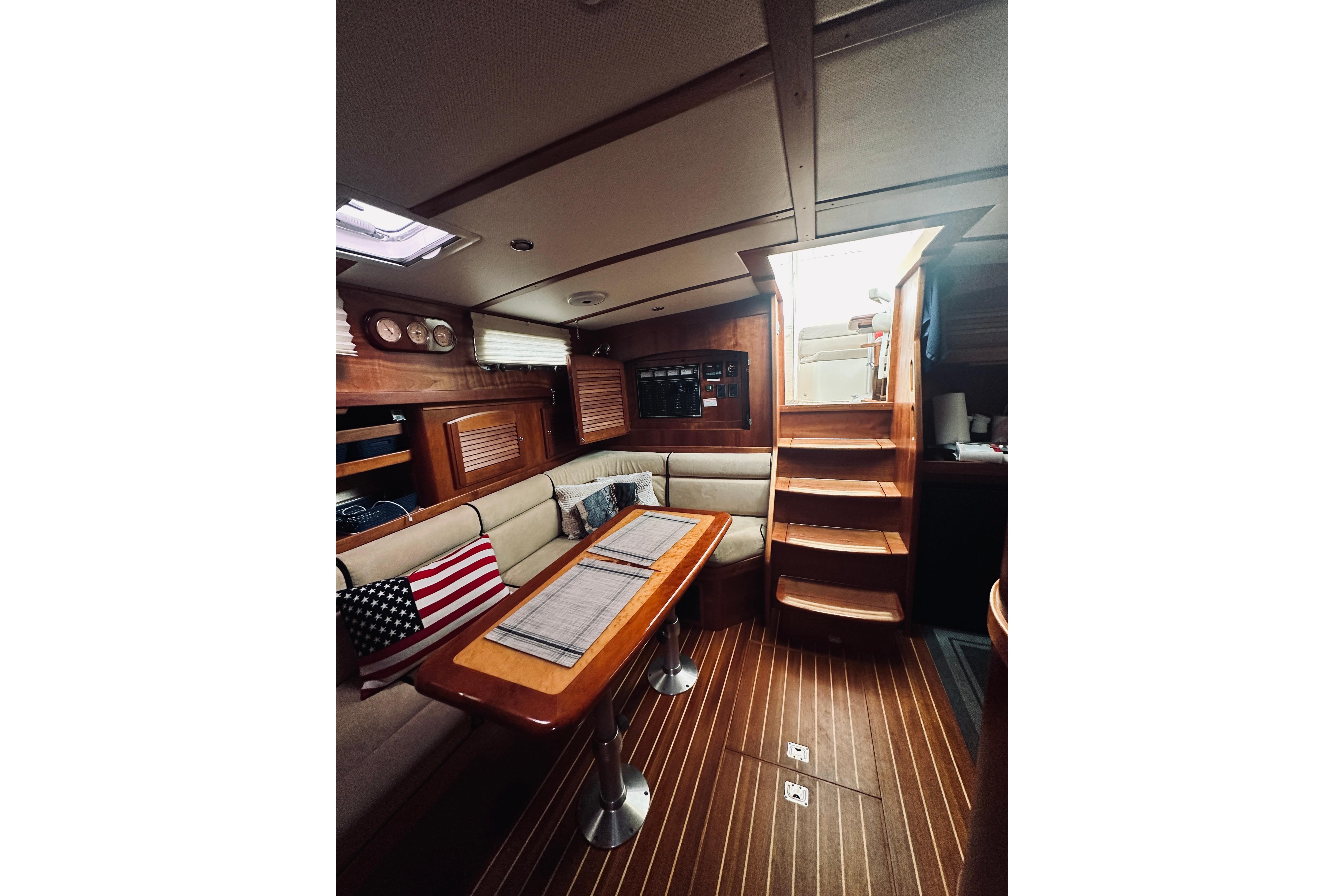 Interior of 2008 Sabre 38 Hard Top Express yacht with wooden finishes and cozy seating.