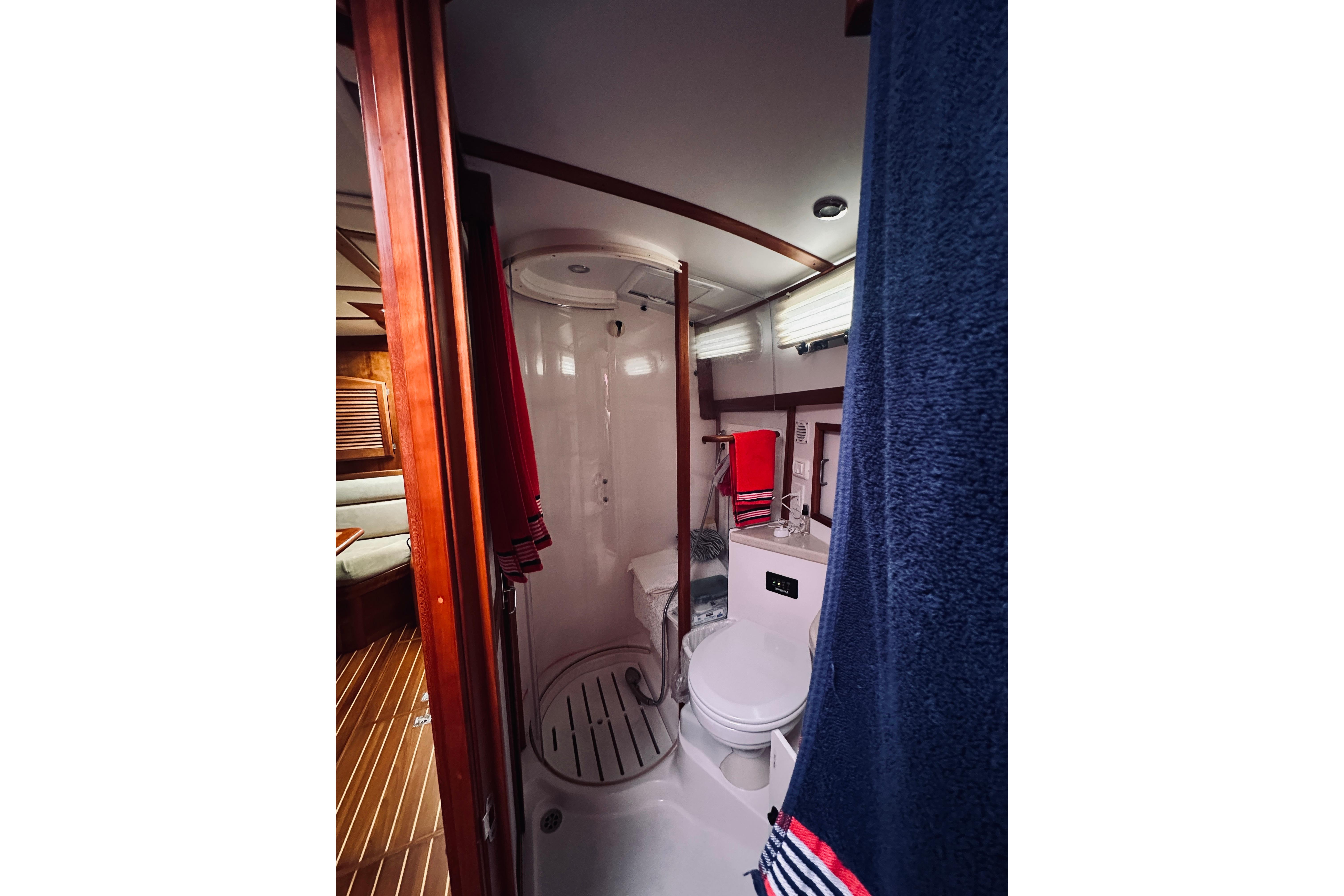 Bathroom interior of 2008 Sabre 38 Hard Top Express yacht, featuring shower and toilet.