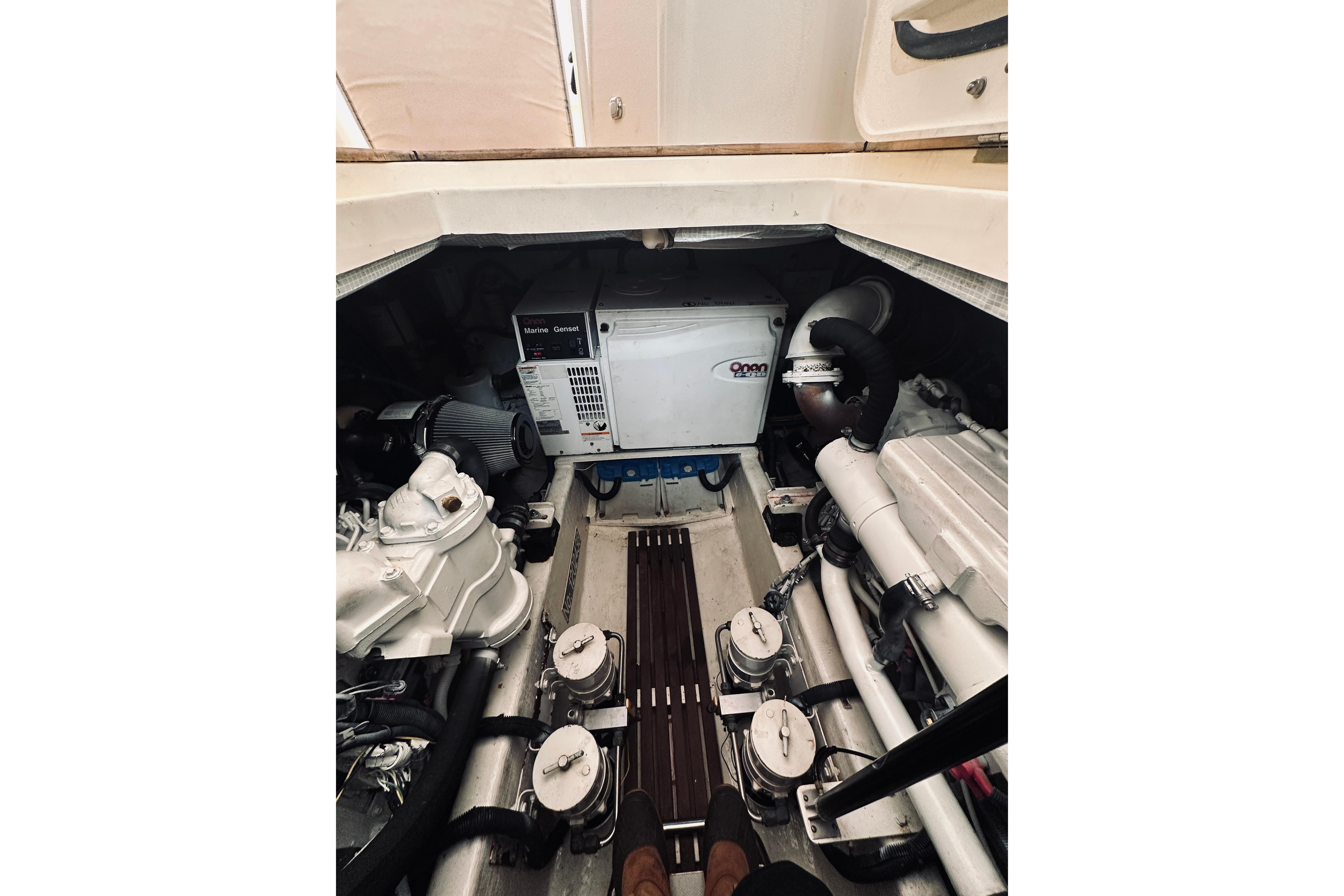 Engine room of 2008 Sabre 38 Hard Top Express with generator and mechanical components.