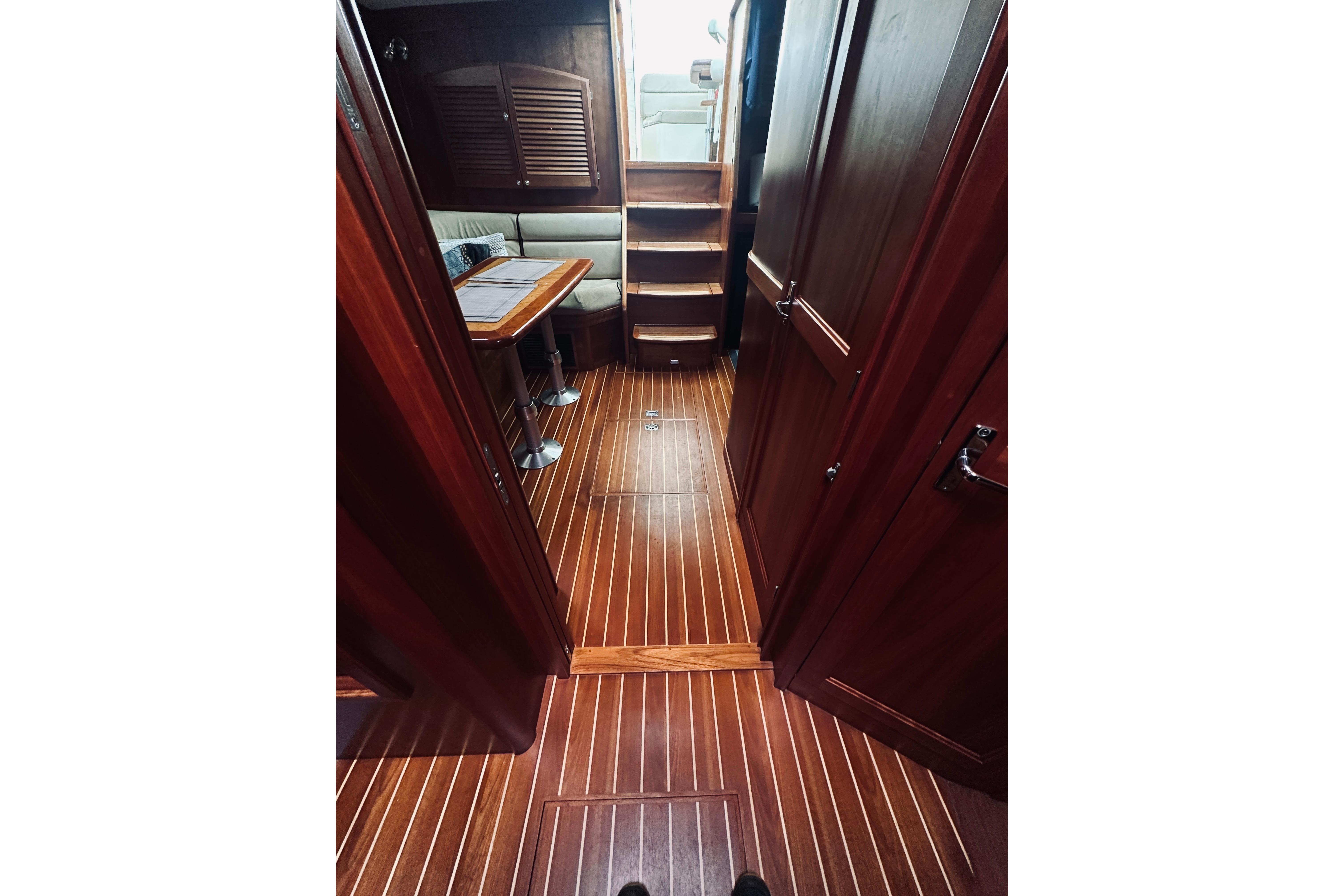 2008 Sabre 38 Hard Top Express interior with wooden flooring and seating area.