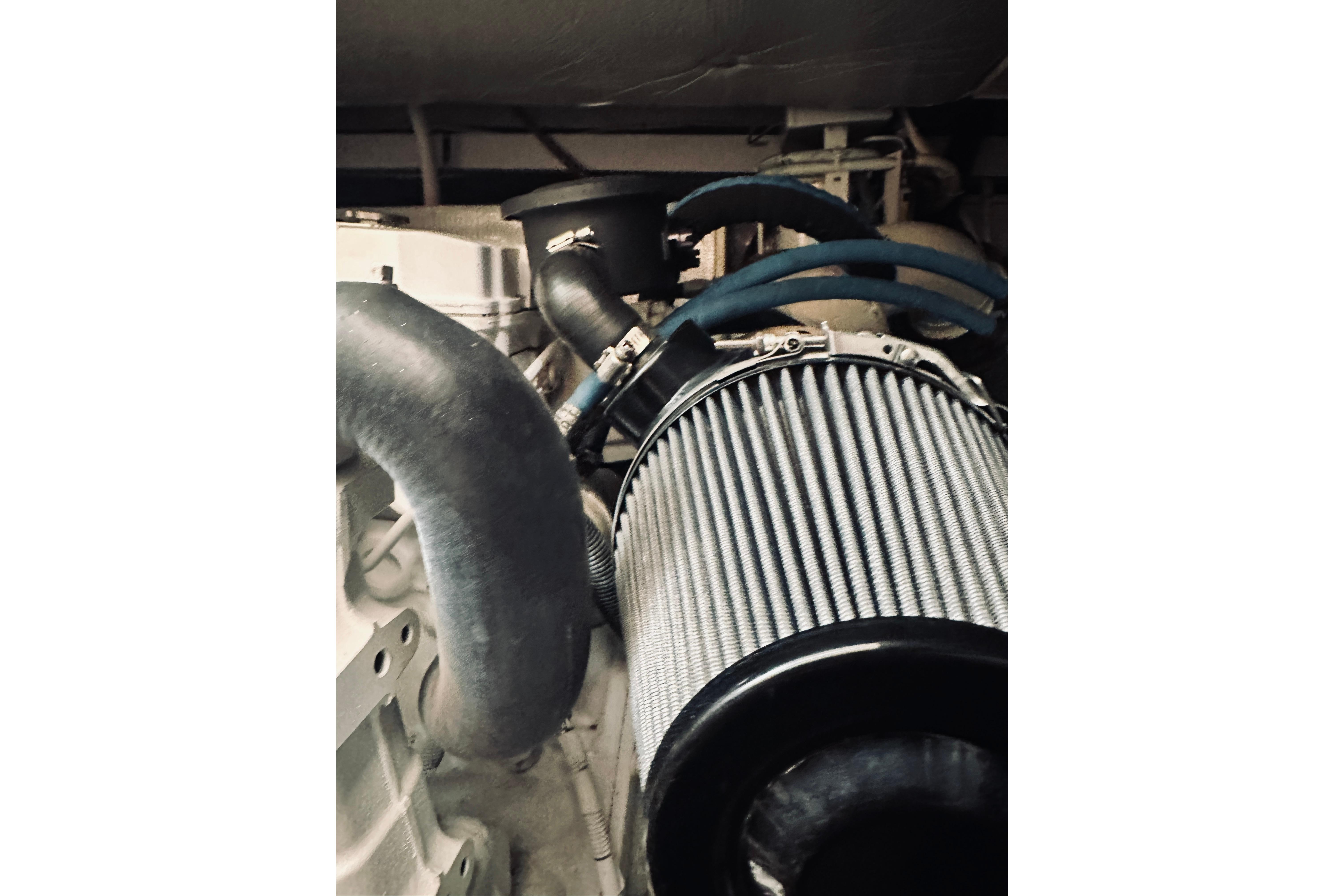 Engine compartment of 2008 Sabre 38 Hard Top Express with visible air filter and hoses.