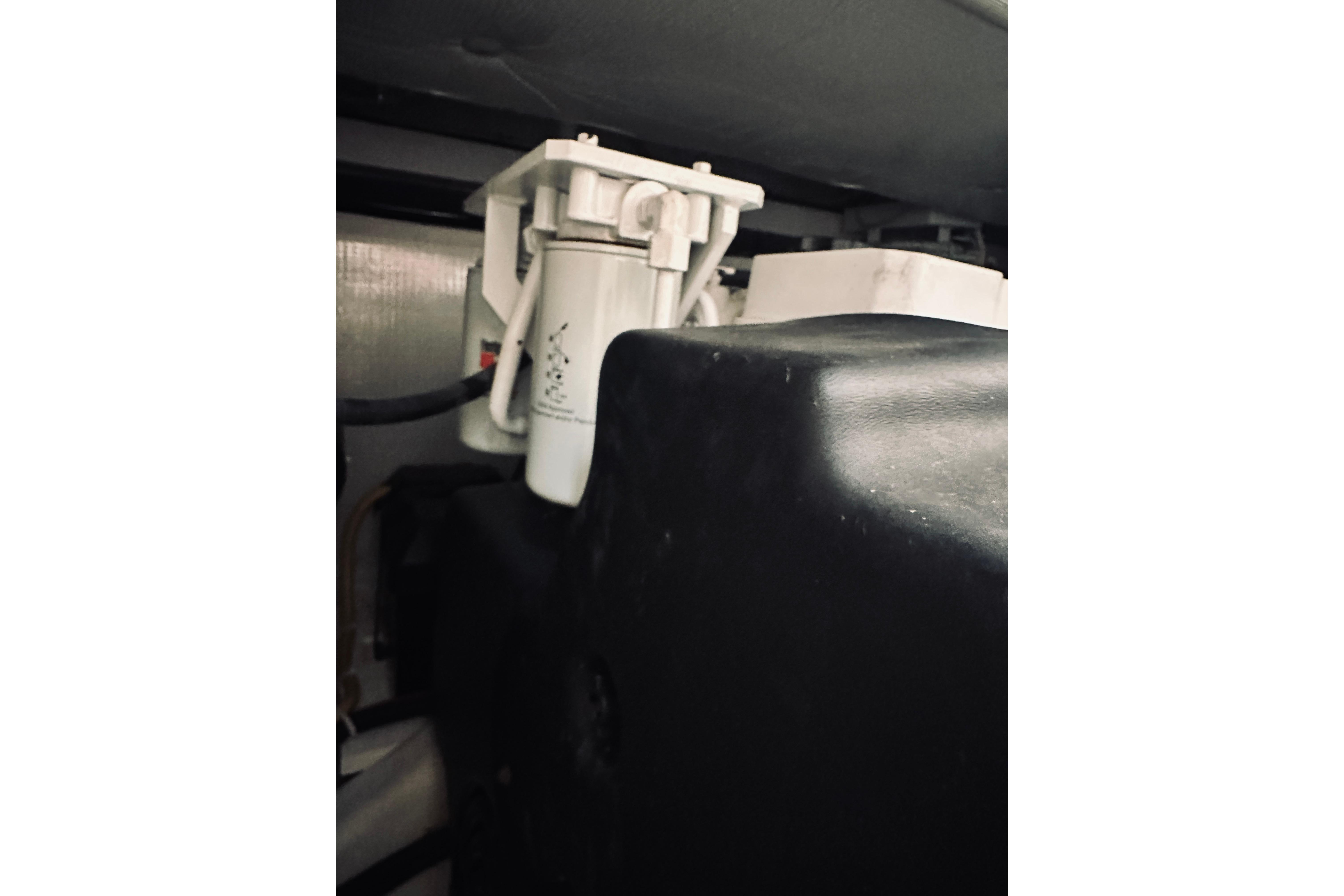 Engine compartment of 2008 Sabre 38 Hard Top Express boat, featuring a filter system.