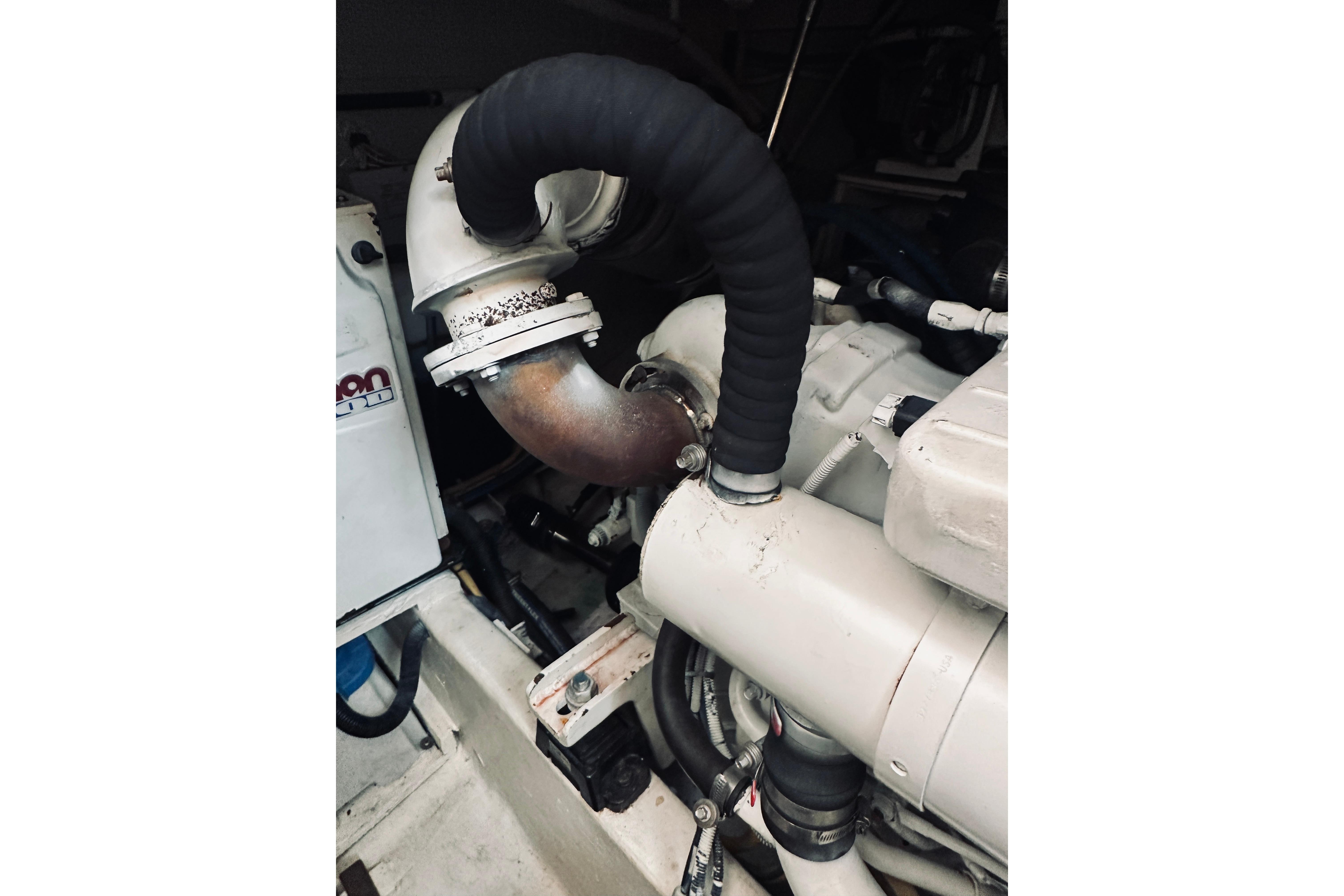 Engine compartment of 2008 Sabre 38 Hard Top Express boat, showing exhaust system components.