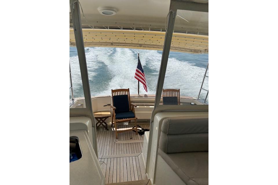 2008 Sabre 38 Hard Top Express boat interior with American flag and ocean view.