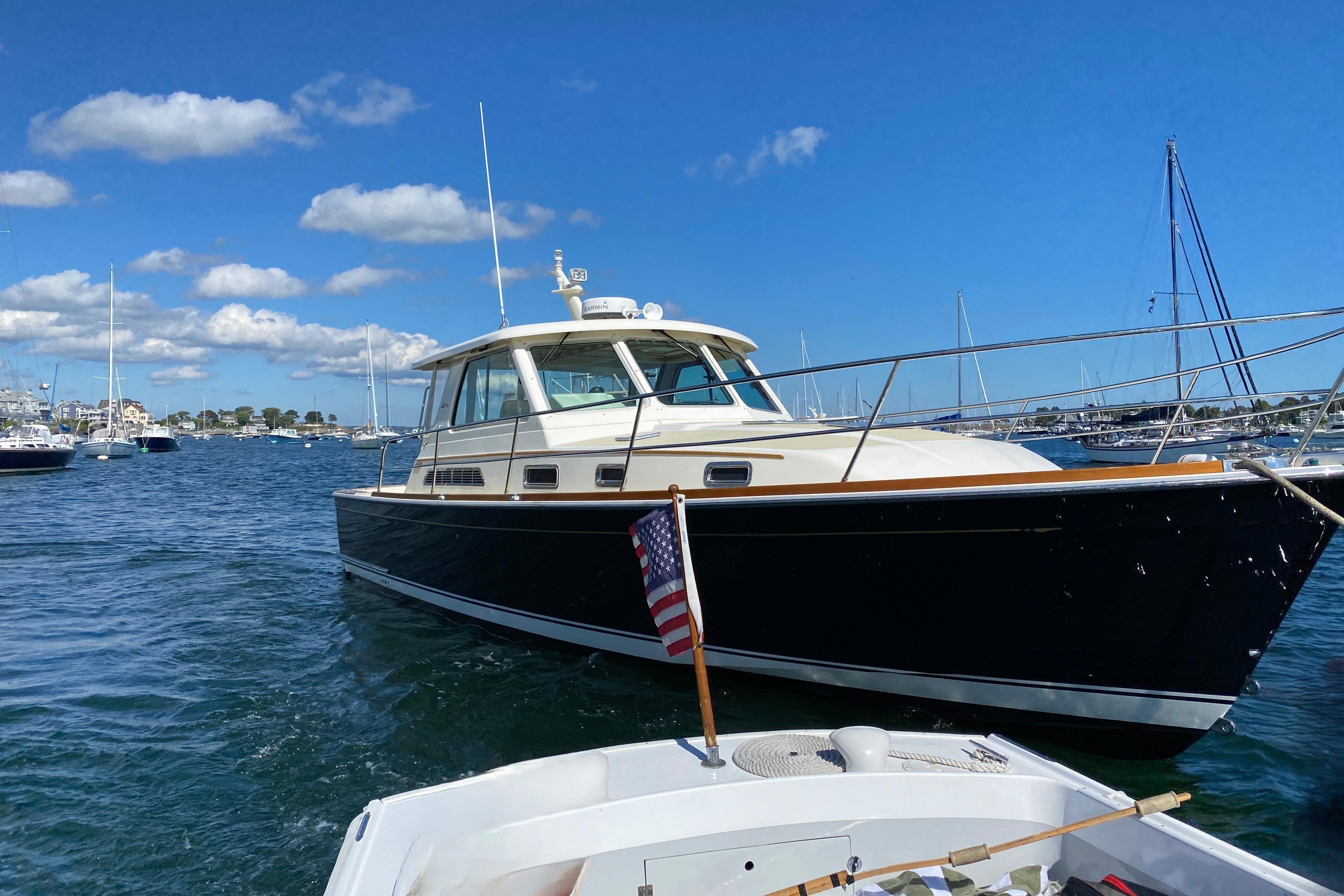 2008 Sabre 38 Hard Top Express boat on a sunny day in a marina.