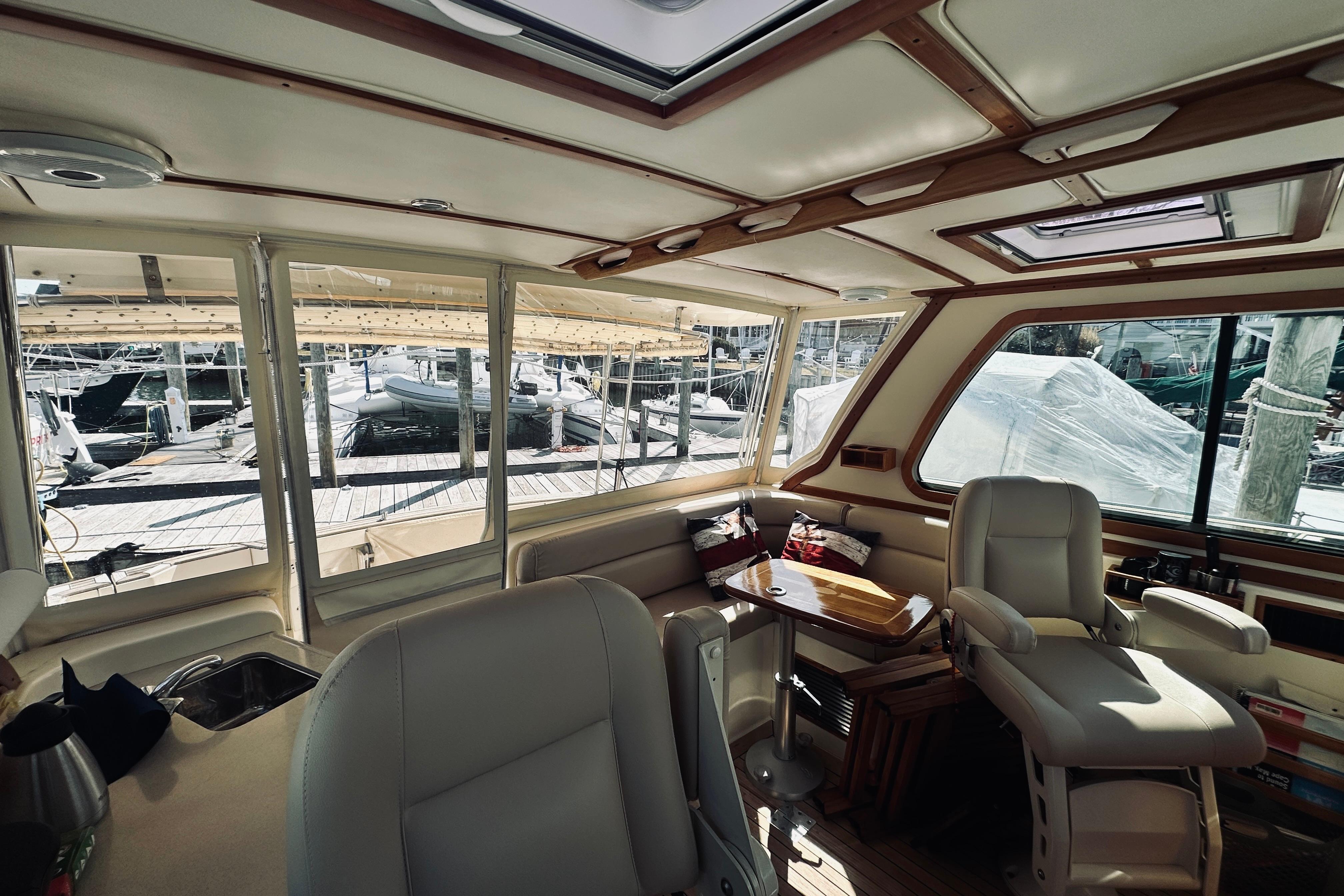Interior of 2008 Sabre 38 Hard Top Express yacht with elegant seating and wooden accents.
