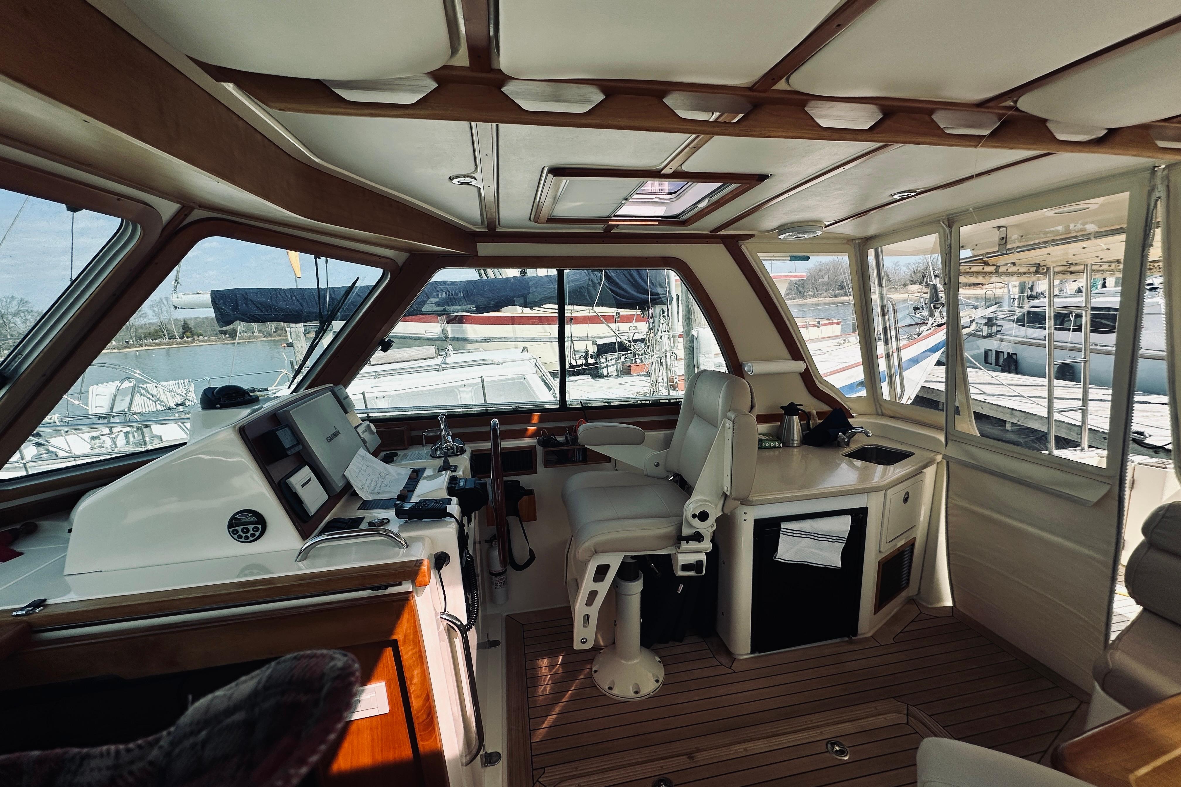 Interior of 2008 Sabre 38 Hard Top Express yacht with helm and seating area.