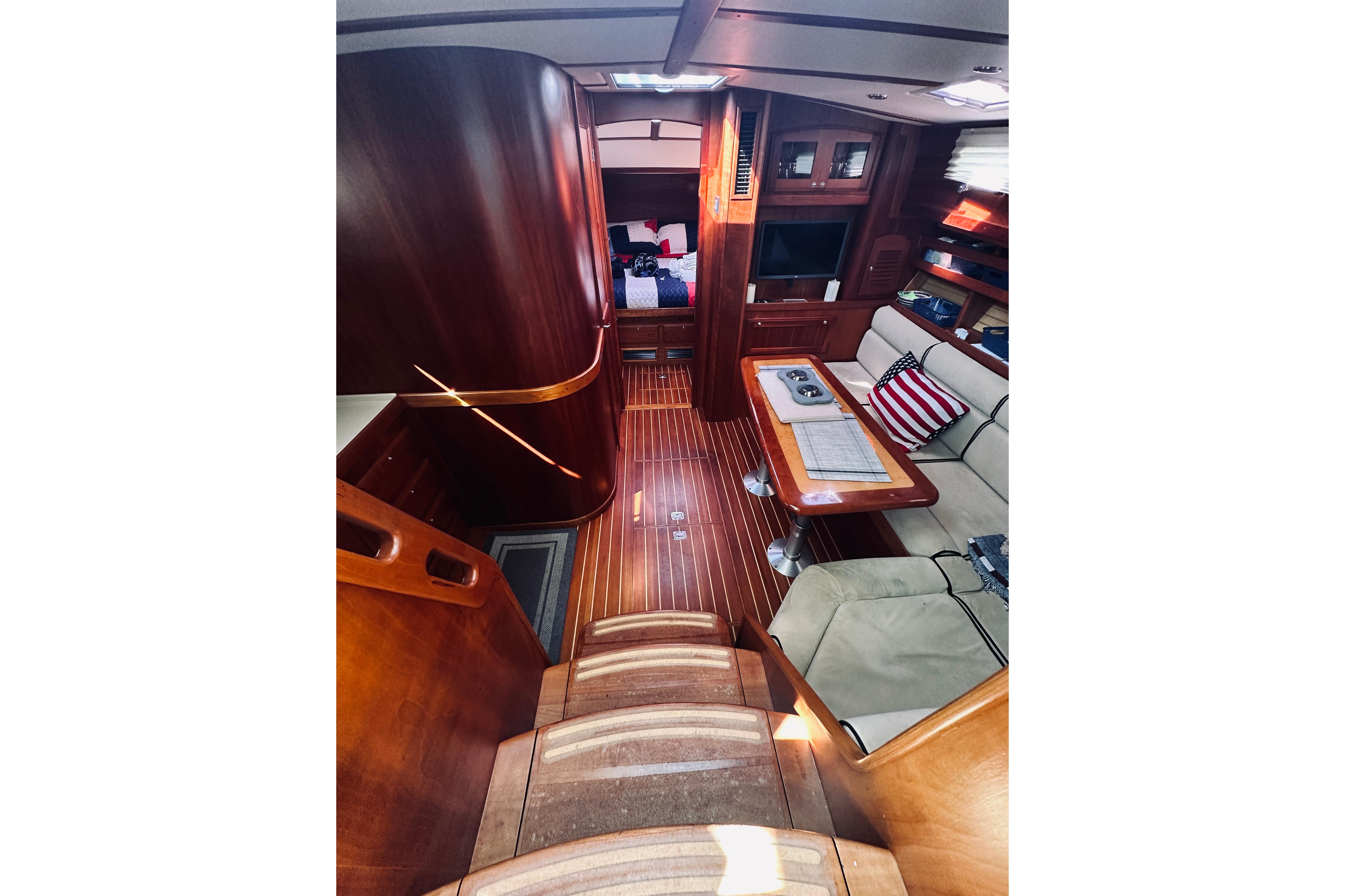 Luxurious interior of 2008 Sabre 38 Hard Top Express yacht with wood finish and cozy seating.