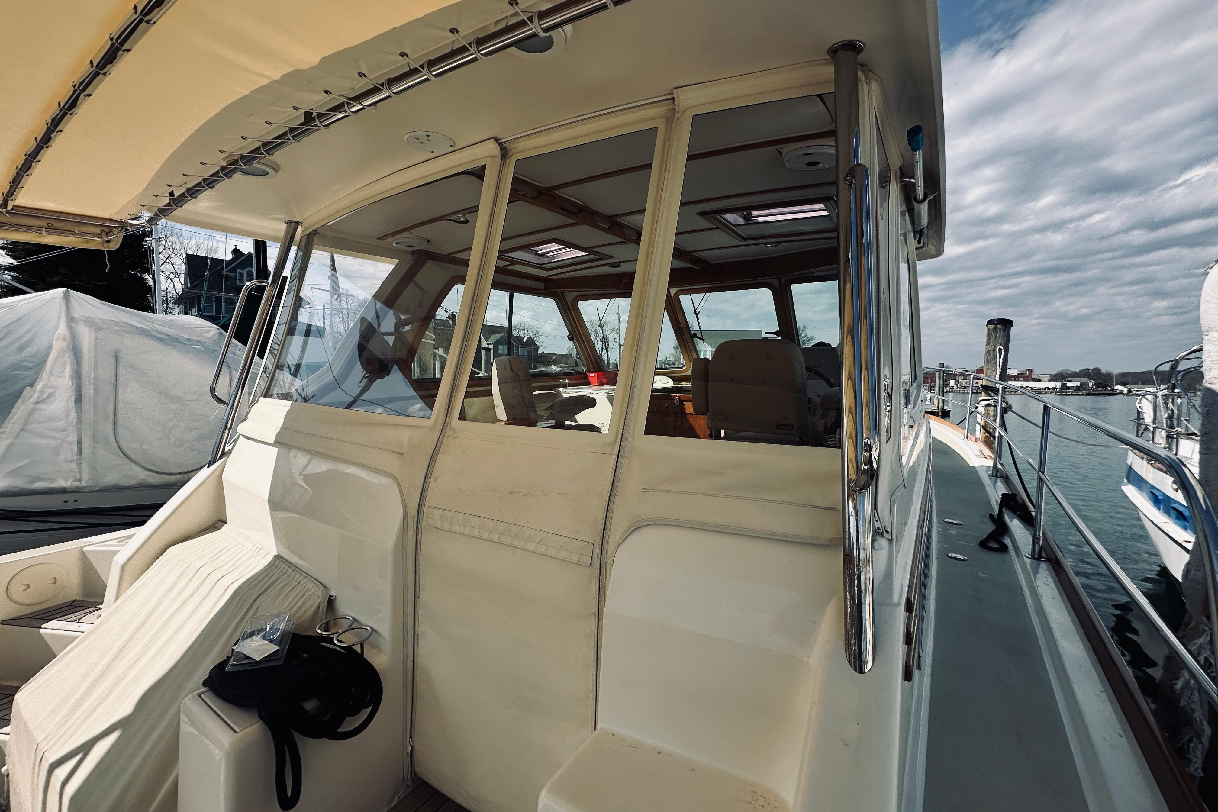 2008 Sabre 38 Hard Top Express yacht docked, showcasing cabin and deck details.