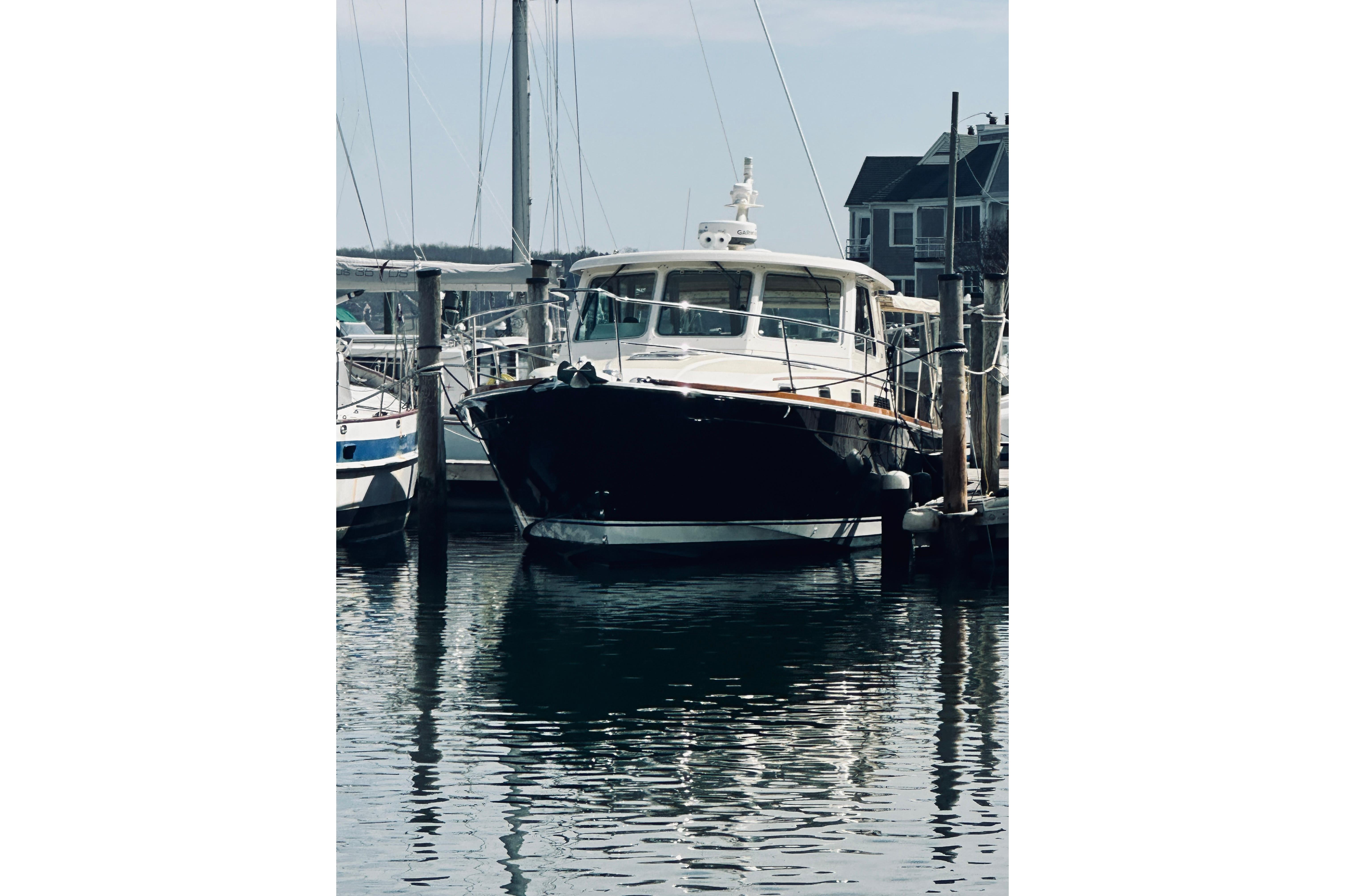 2008 Sabre 38 Hard Top Express yacht docked at marina.