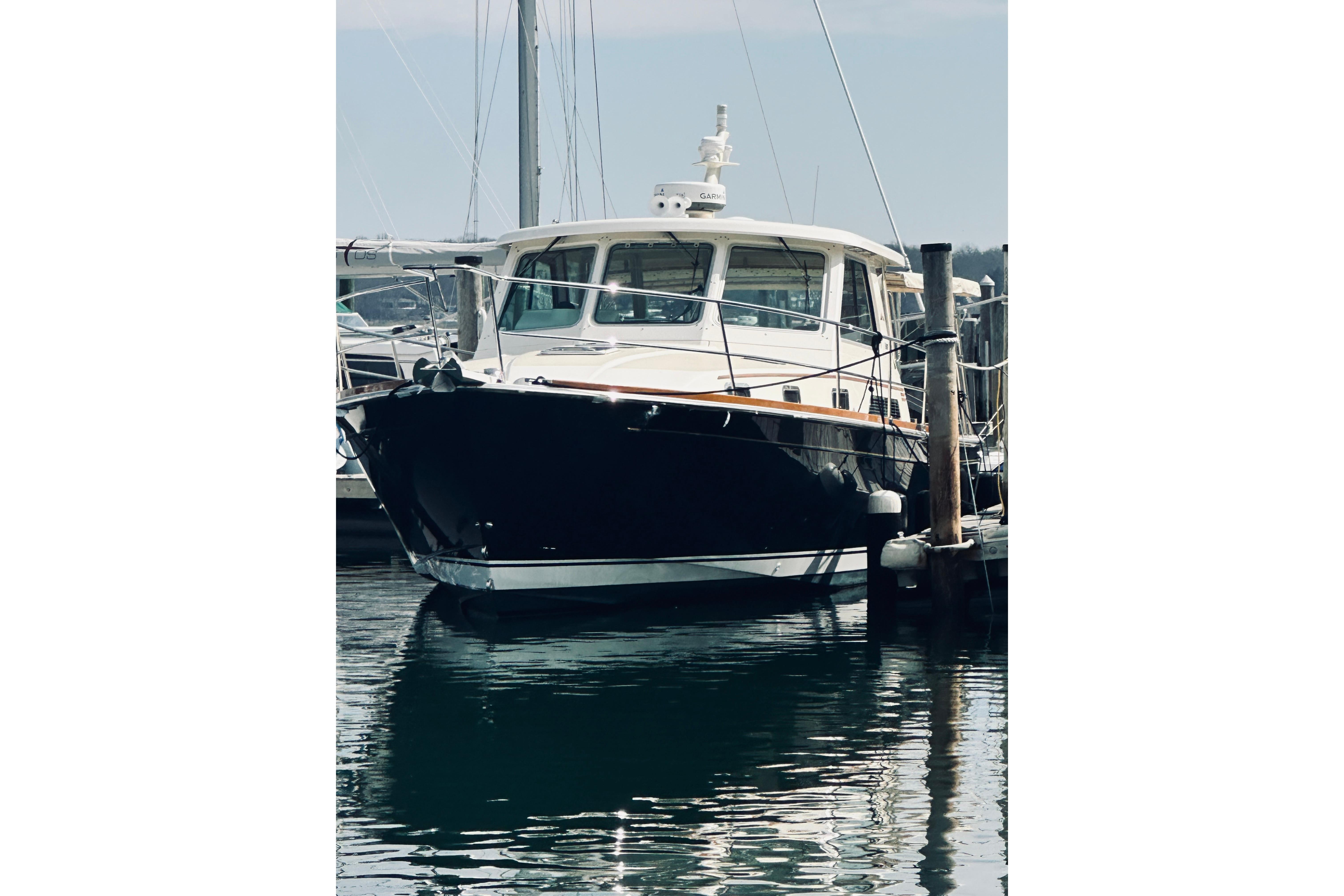 2008 Sabre 38 Hard Top Express yacht docked at marina.