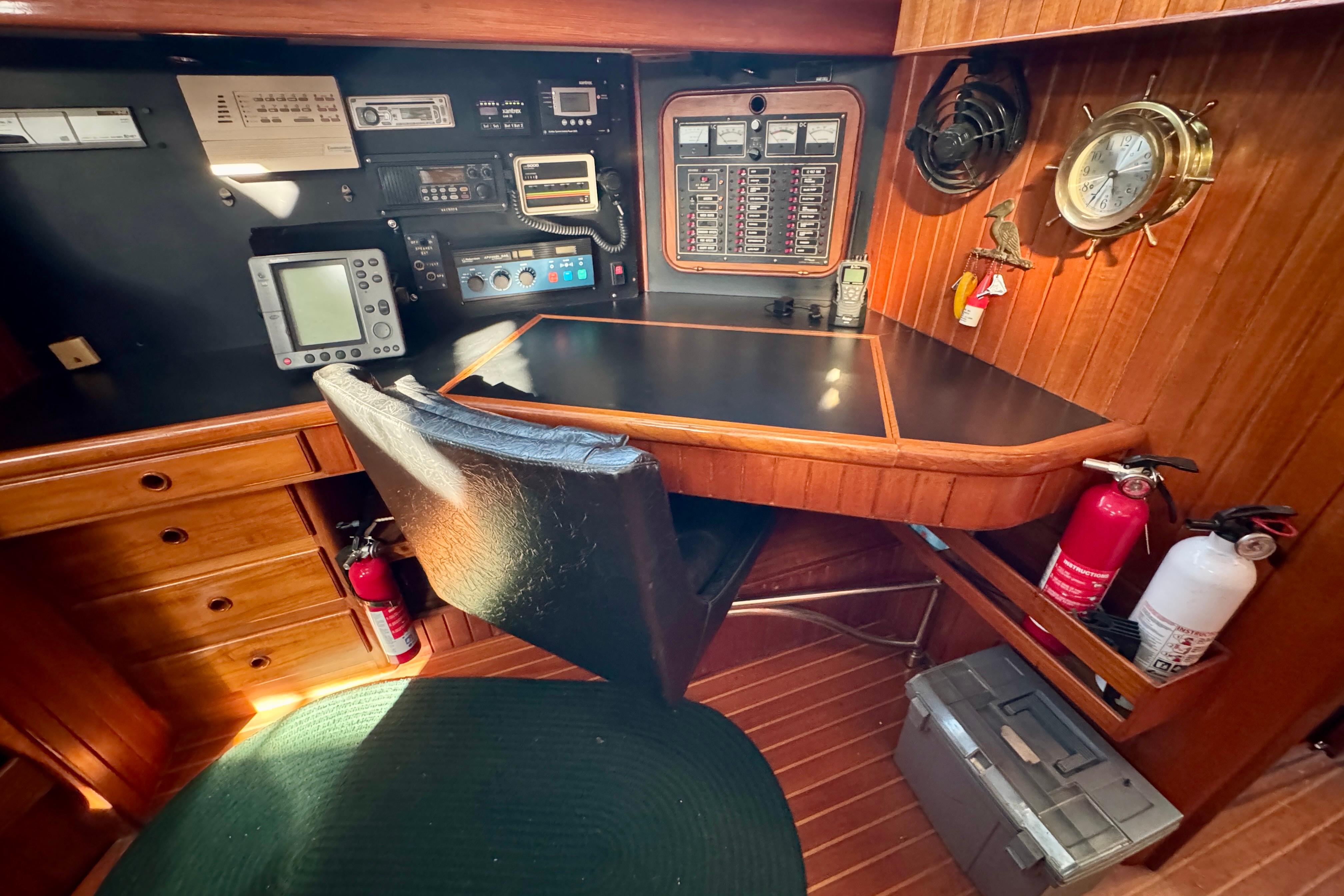 Navigation station on 1988 Hans Christian Christina yacht with control panels and equipment.
