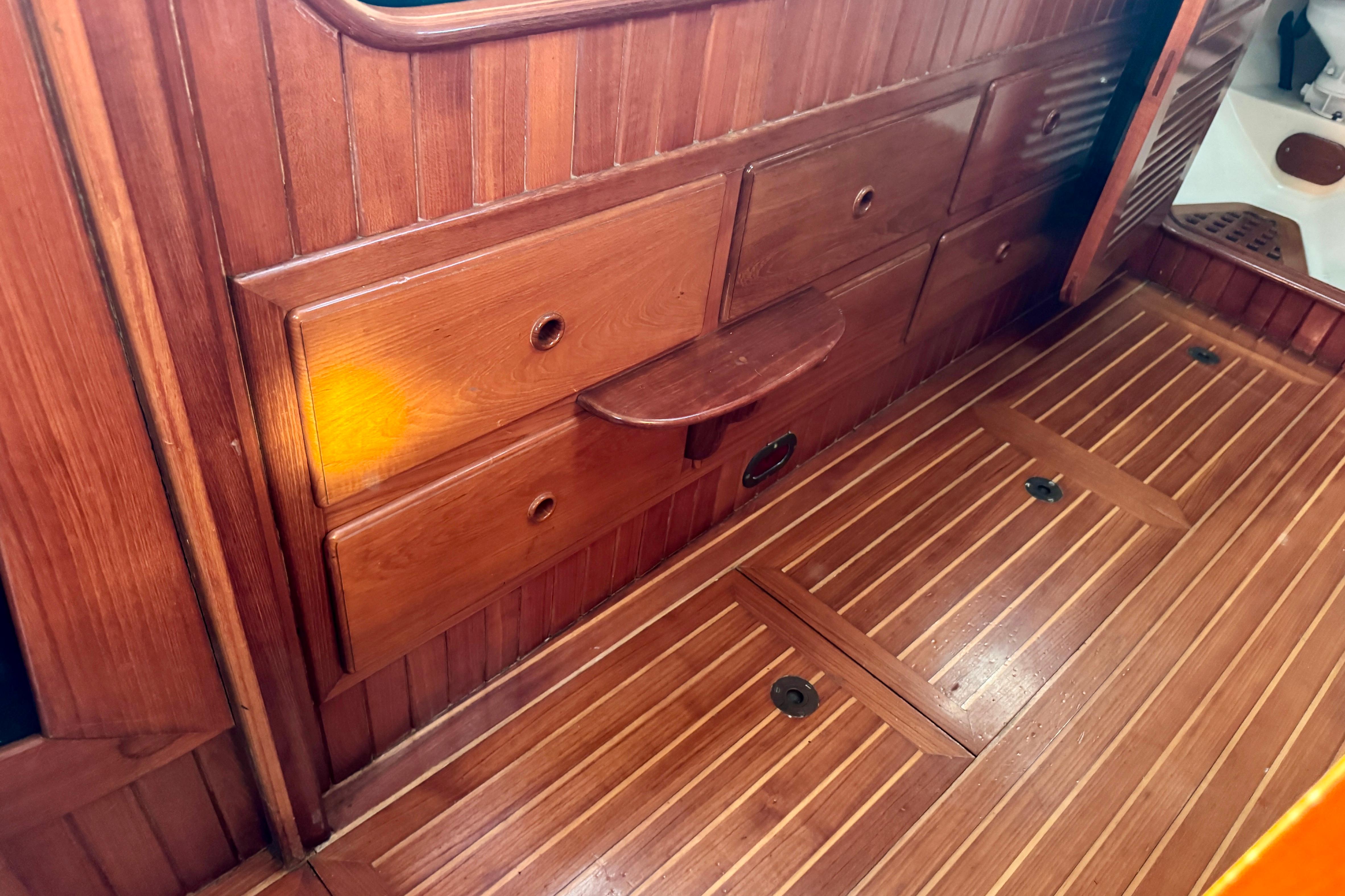 Interior of 1988 Hans Christian Christina boat with wooden cabinetry and flooring.