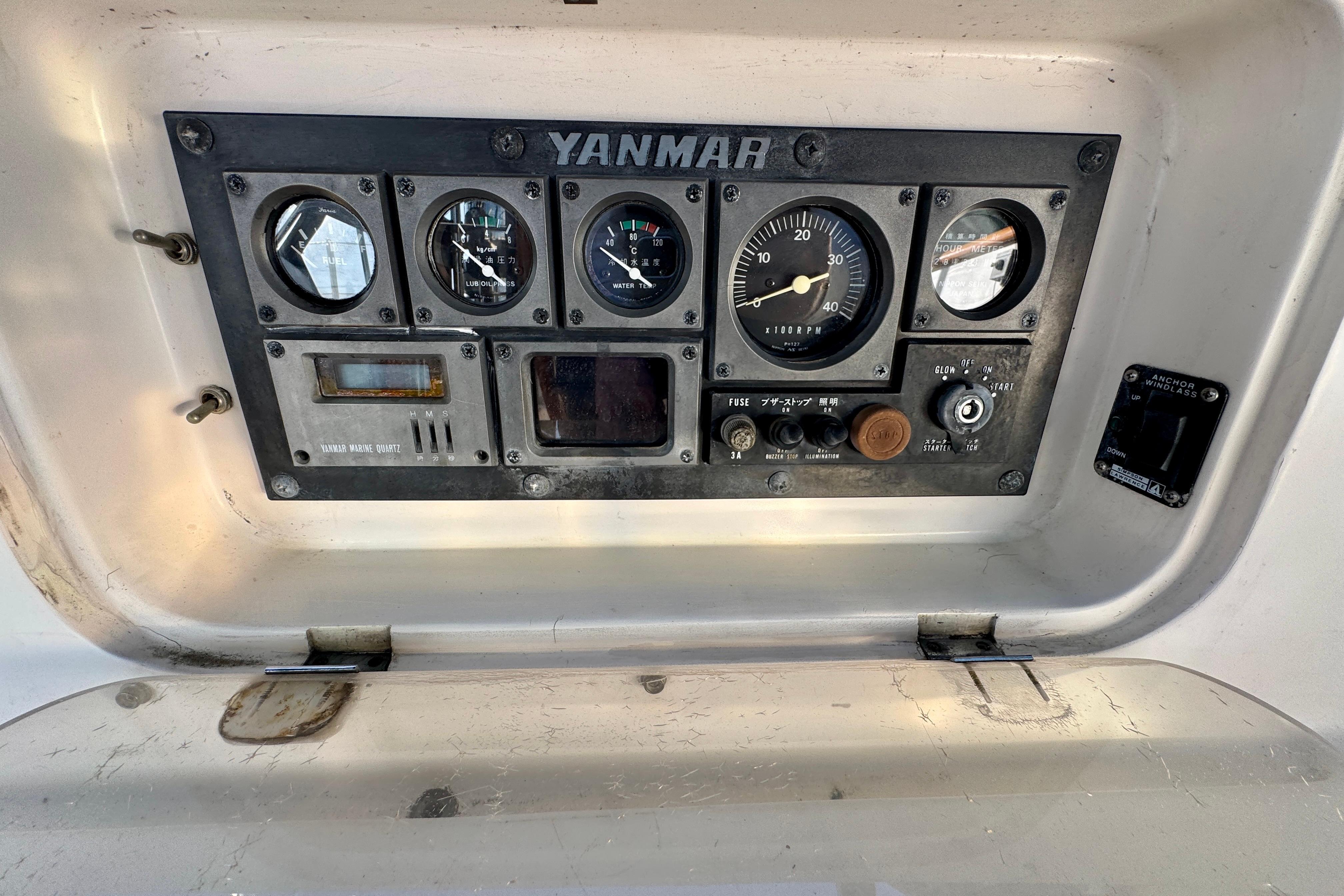 Control panel of a 1988 Hans Christian Christina boat with Yanmar engine gauges.