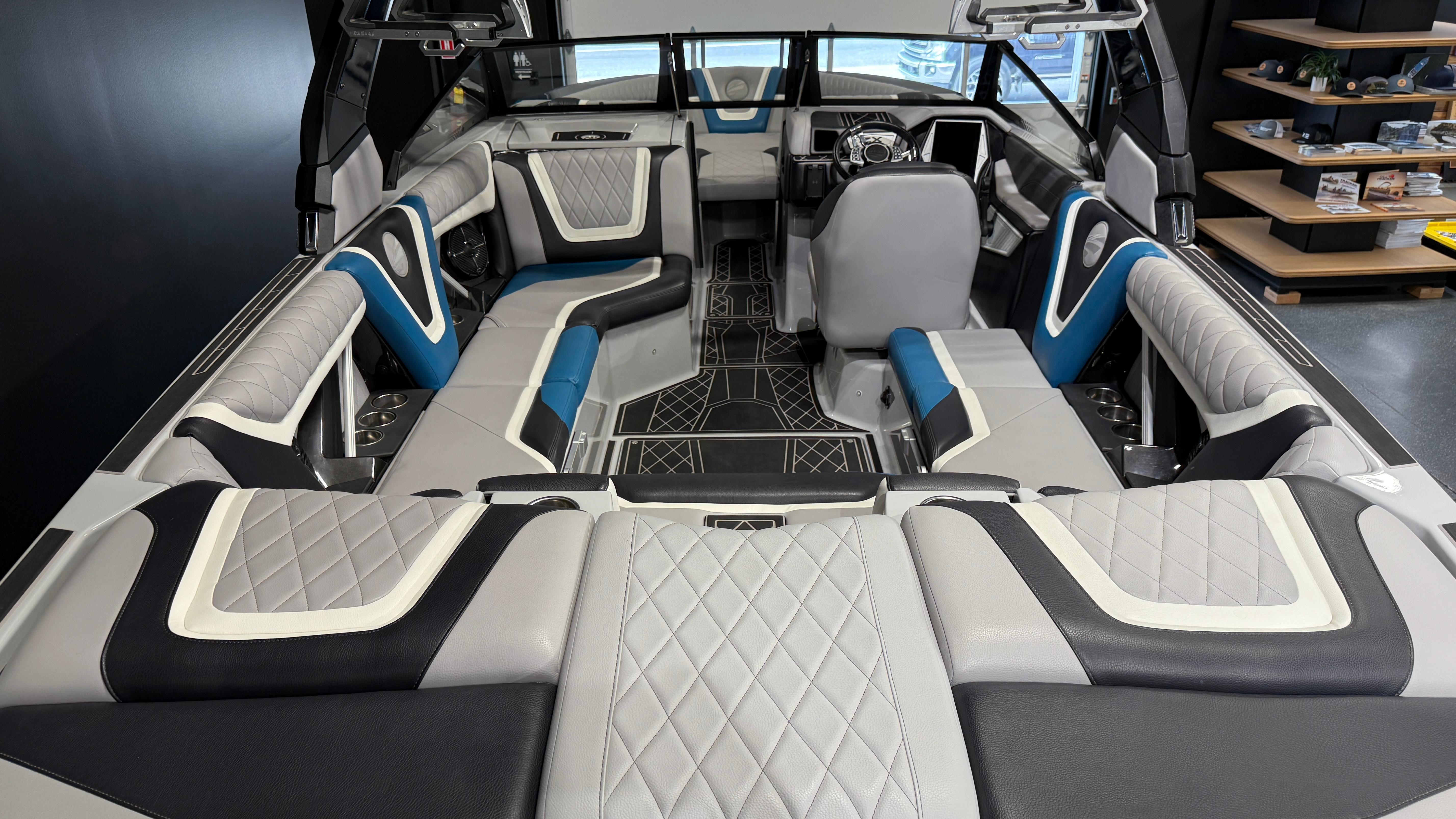 Luxurious interior of 2022 Tigé 23ZX boat with modern seating and stylish design.