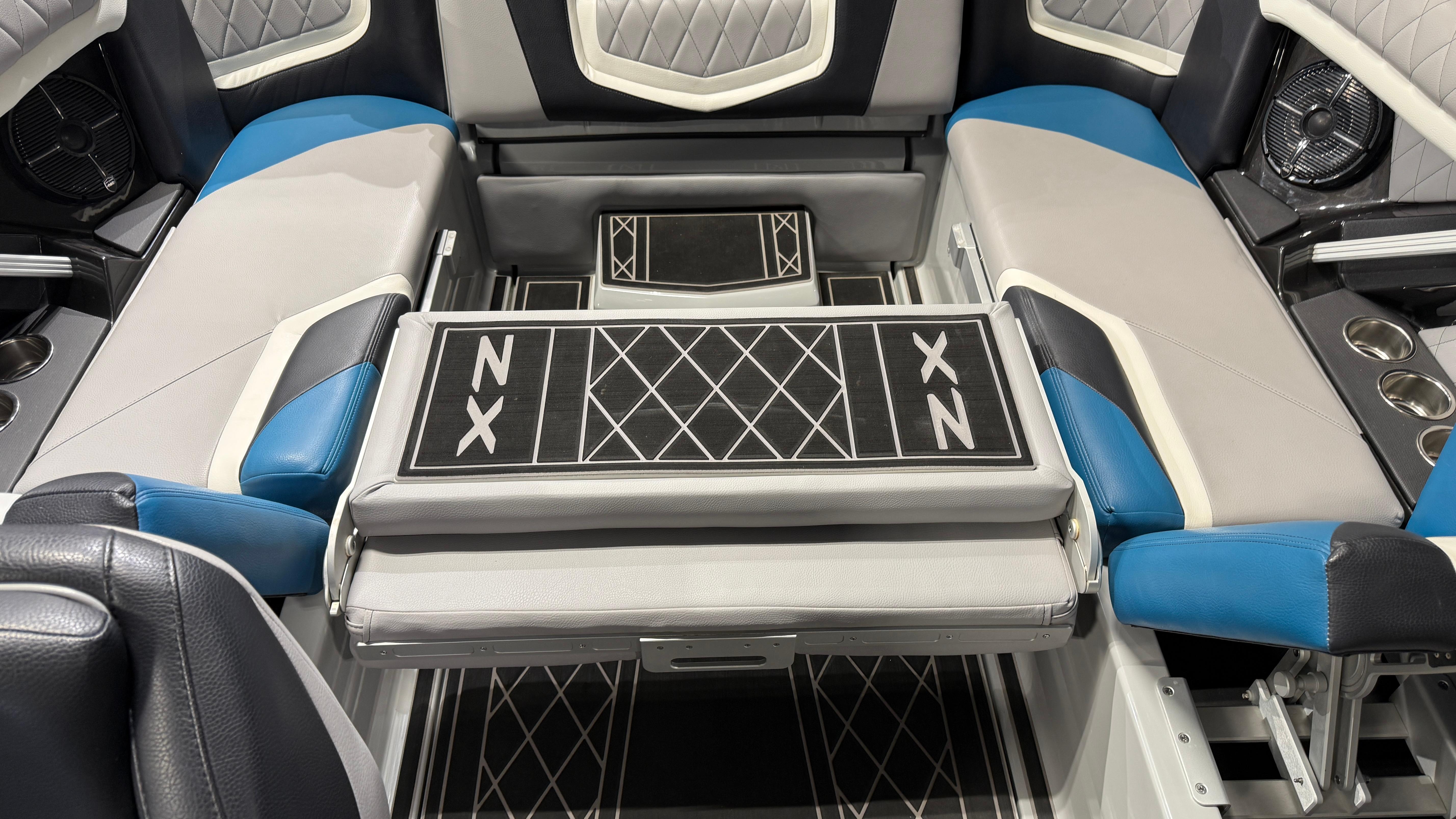 2022 Tigé 23ZX boat interior with blue and gray seating and stylish design.