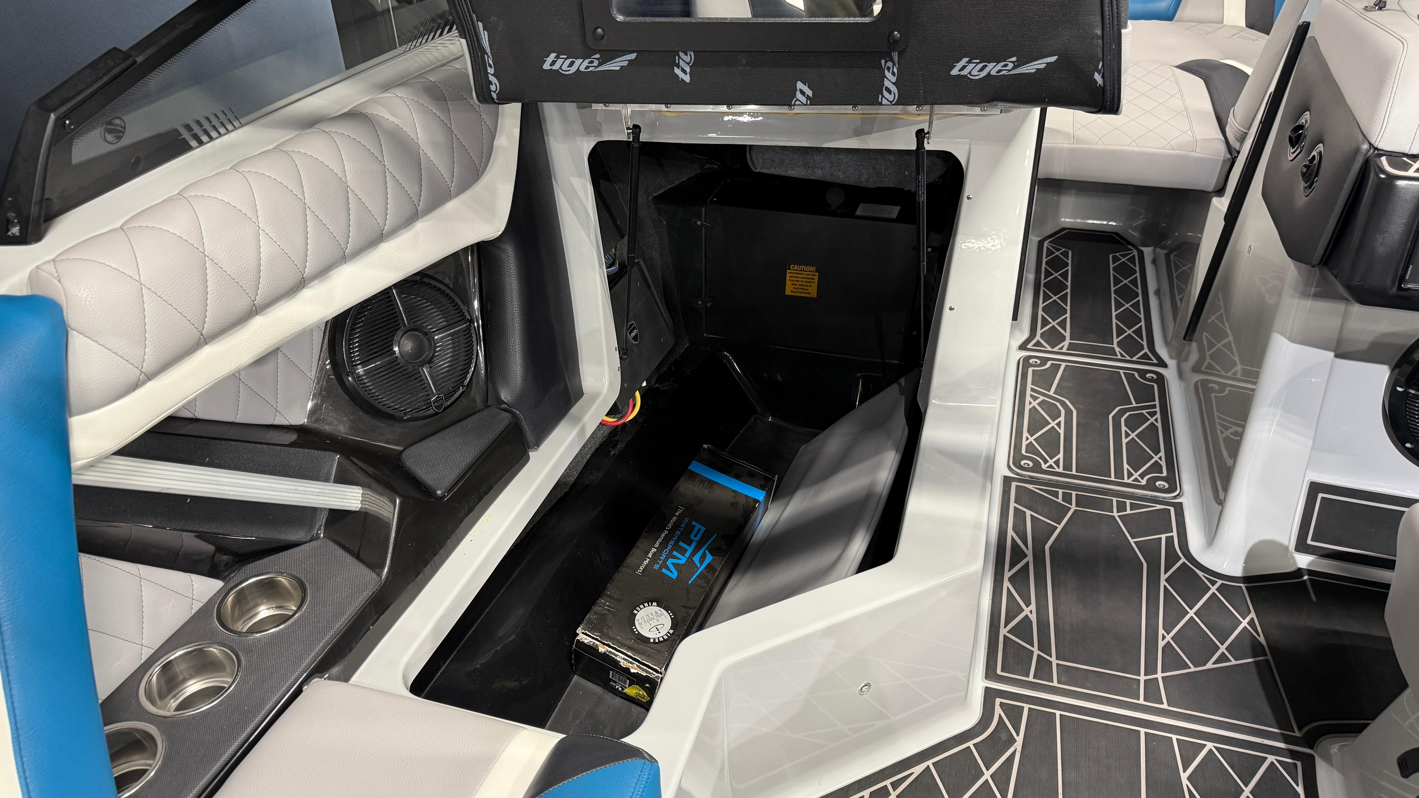 2022 Tigé 23ZX boat interior with storage compartment and modern seating design.