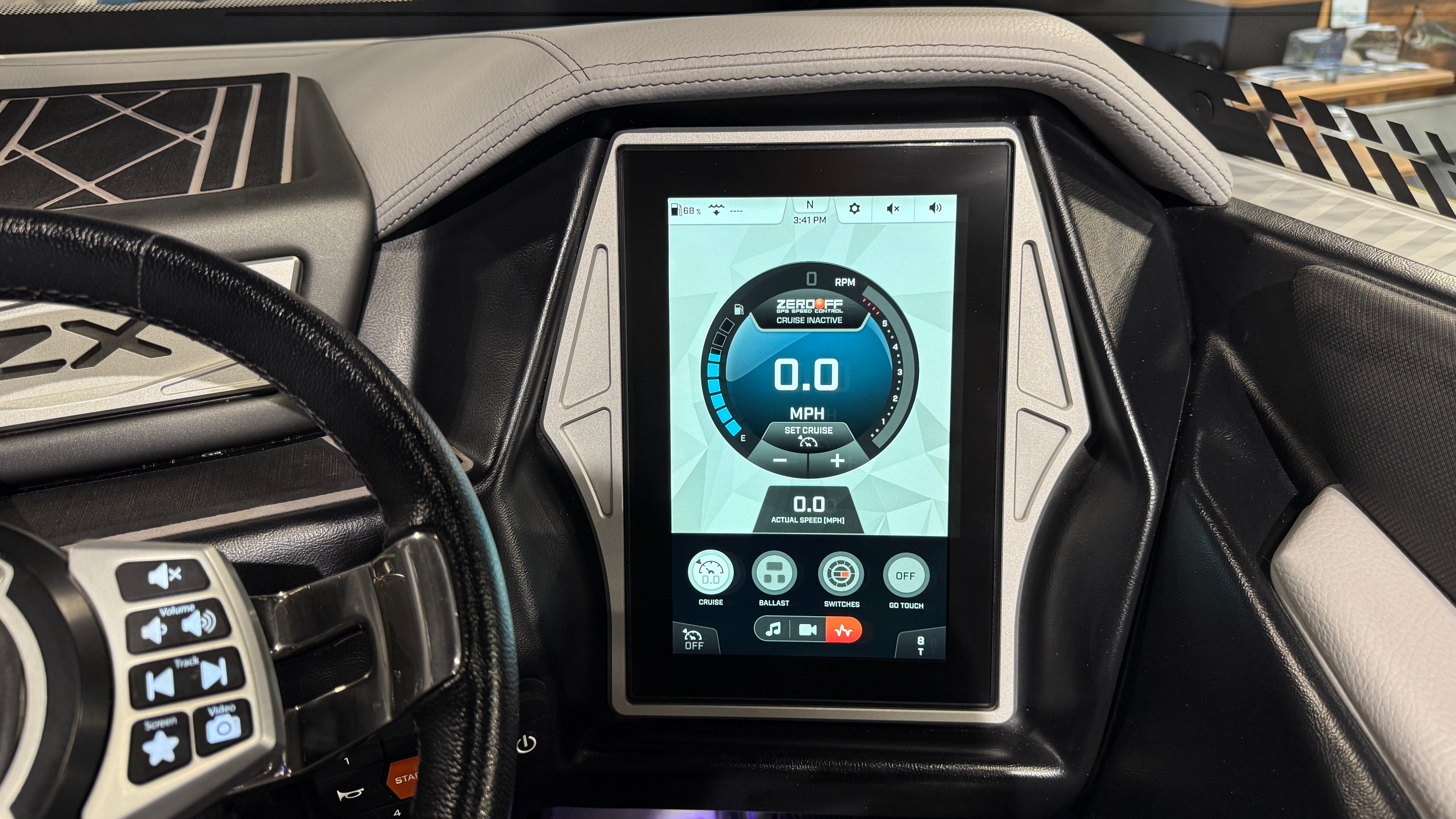 2022 Tigé 23ZX boat dashboard with touchscreen display showing speed and controls.