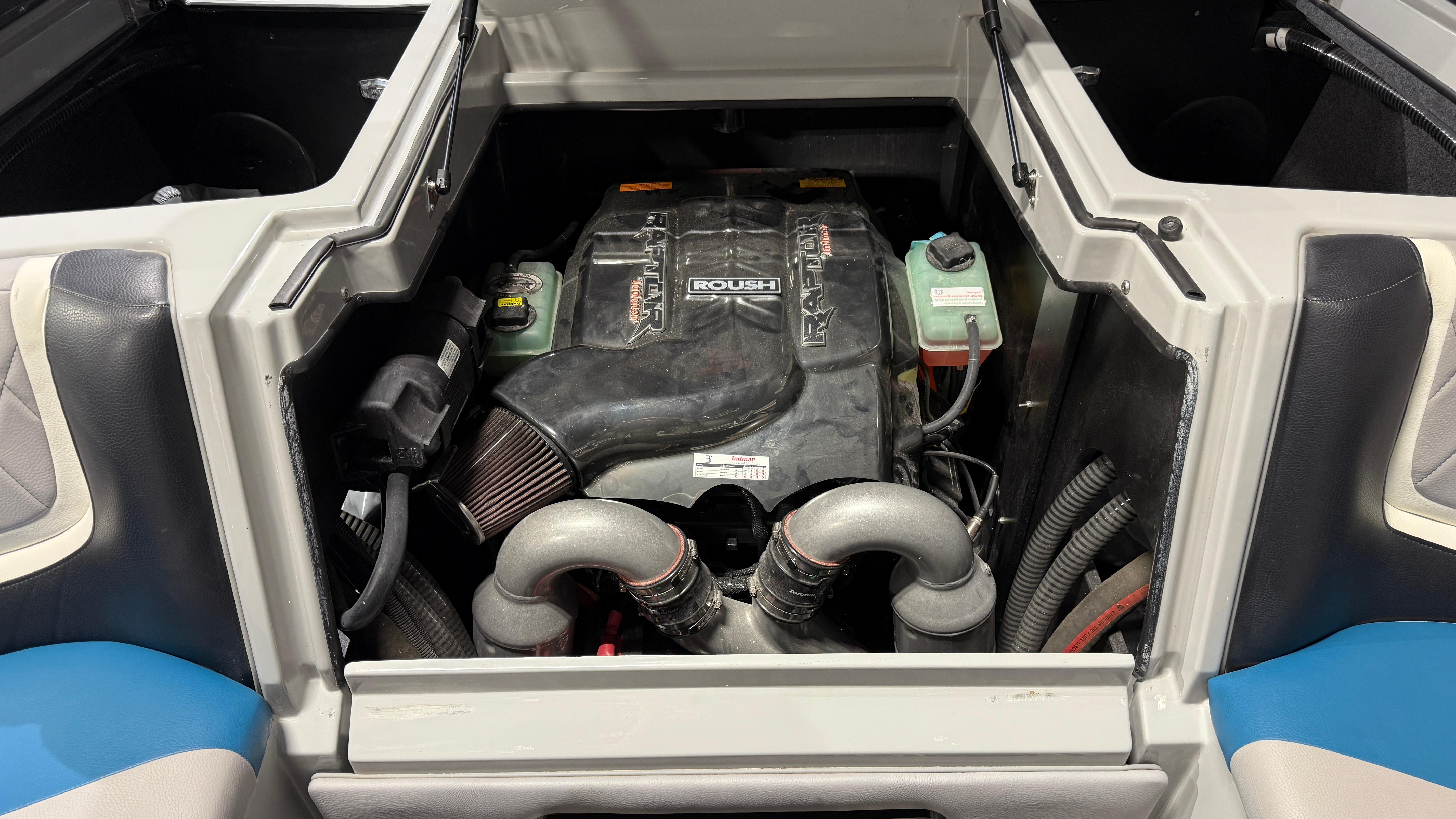 Engine compartment of 2022 Tigé 23ZX boat, showcasing powerful engine components.