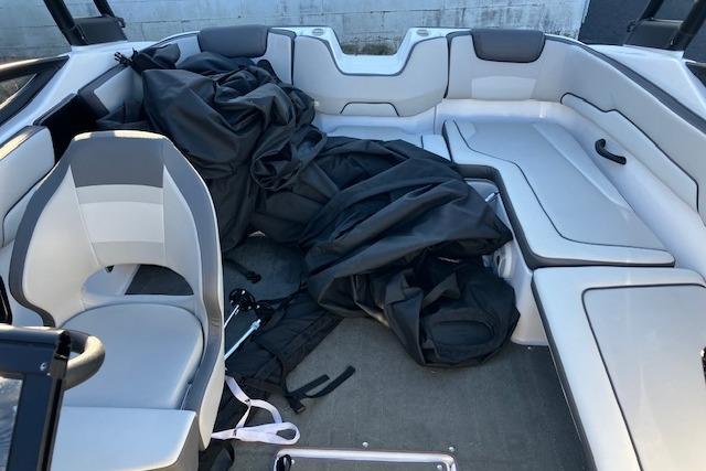 2023 Yamaha Boats AR190 interior with seating and black cover.