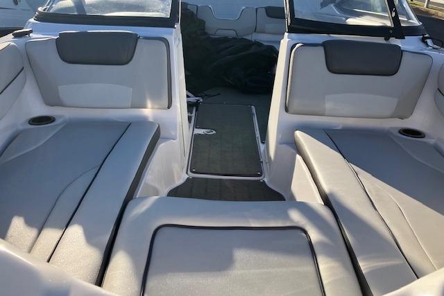 2023 Yamaha Boats AR190 interior with gray seating and cup holders.