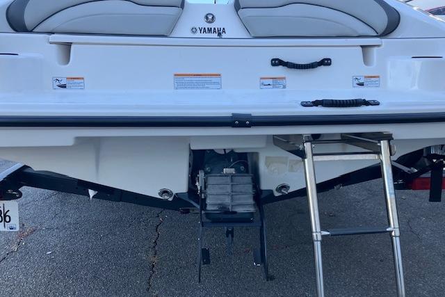 2023 Yamaha Boats AR190 rear view with swim platform and ladder.