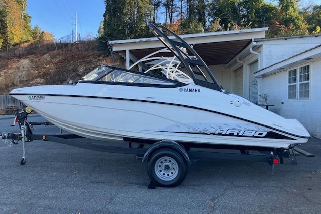 2023 Yamaha Boats AR190 on trailer, parked outdoors near a building.