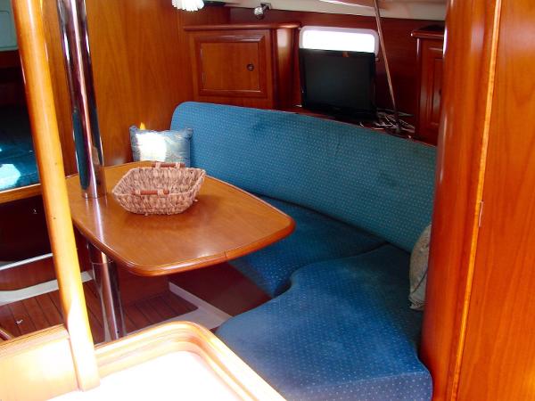 Interior of a 2001 Beneteau 331 yacht with blue upholstery.