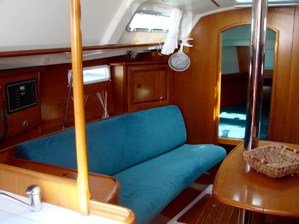 Interior of a 2001 Beneteau 331 yacht with blue upholstery.