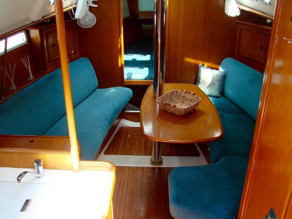 Interior of a 2001 Beneteau 331 yacht with blue upholstery.