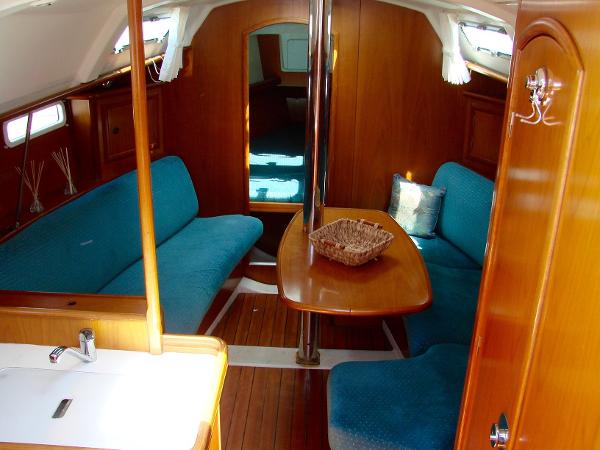Interior of a 2001 Beneteau 331 yacht with blue upholstery.