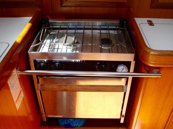 Galley area of a 2001 Beneteau 331 with stainless steel stove.