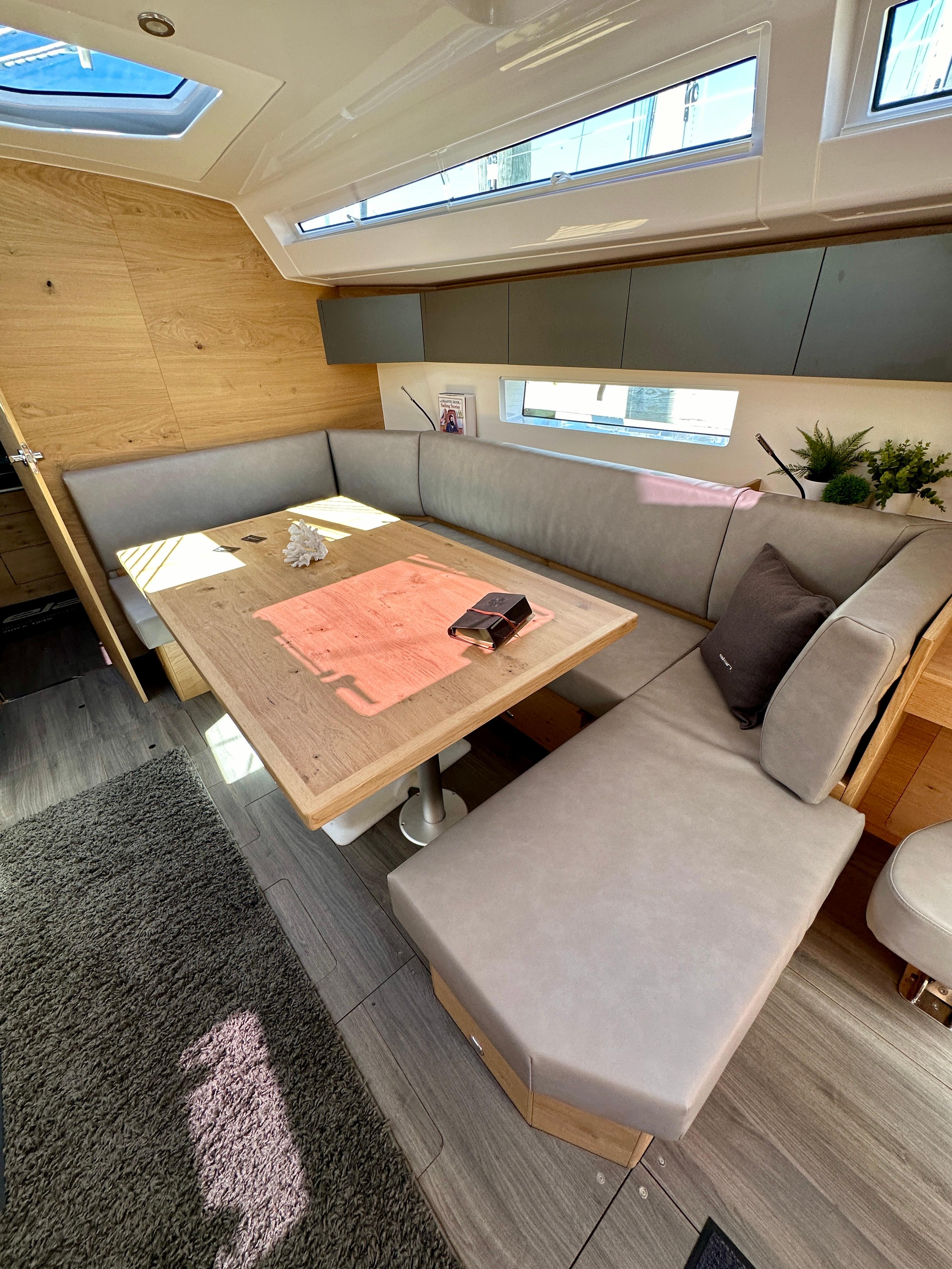 Elan-Impression 43 2024-Hard Loaded CT-US-2024 Elan Impression 43 yacht interior with modern seating and natural light.-9178291 | Thumbnail