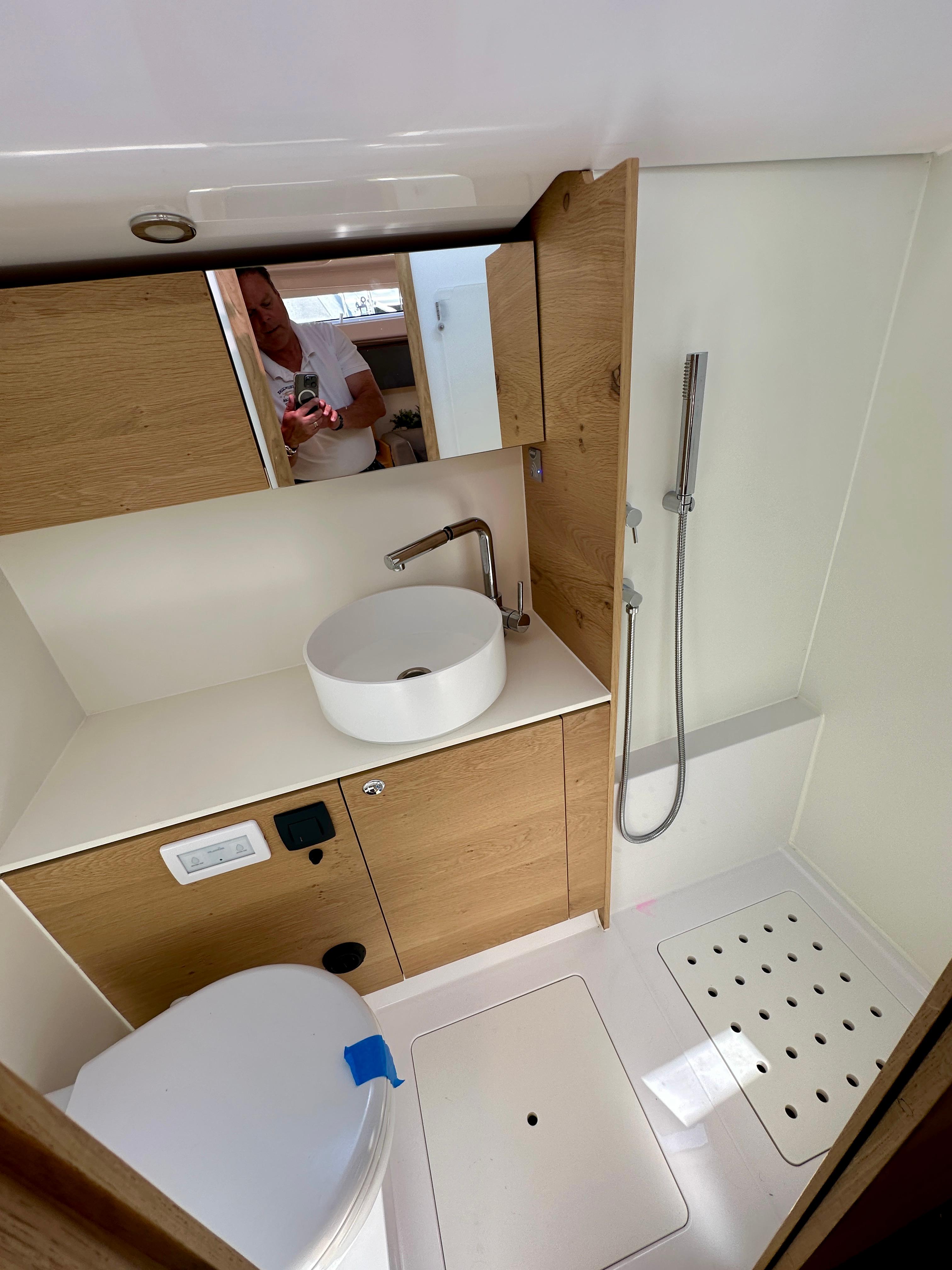 Elan-Impression 43 2024-Hard Loaded CT-US-Modern bathroom in 2024 Elan Impression 43 yacht with sleek fixtures and wooden cabinetry.-9178291 | Thumbnail
